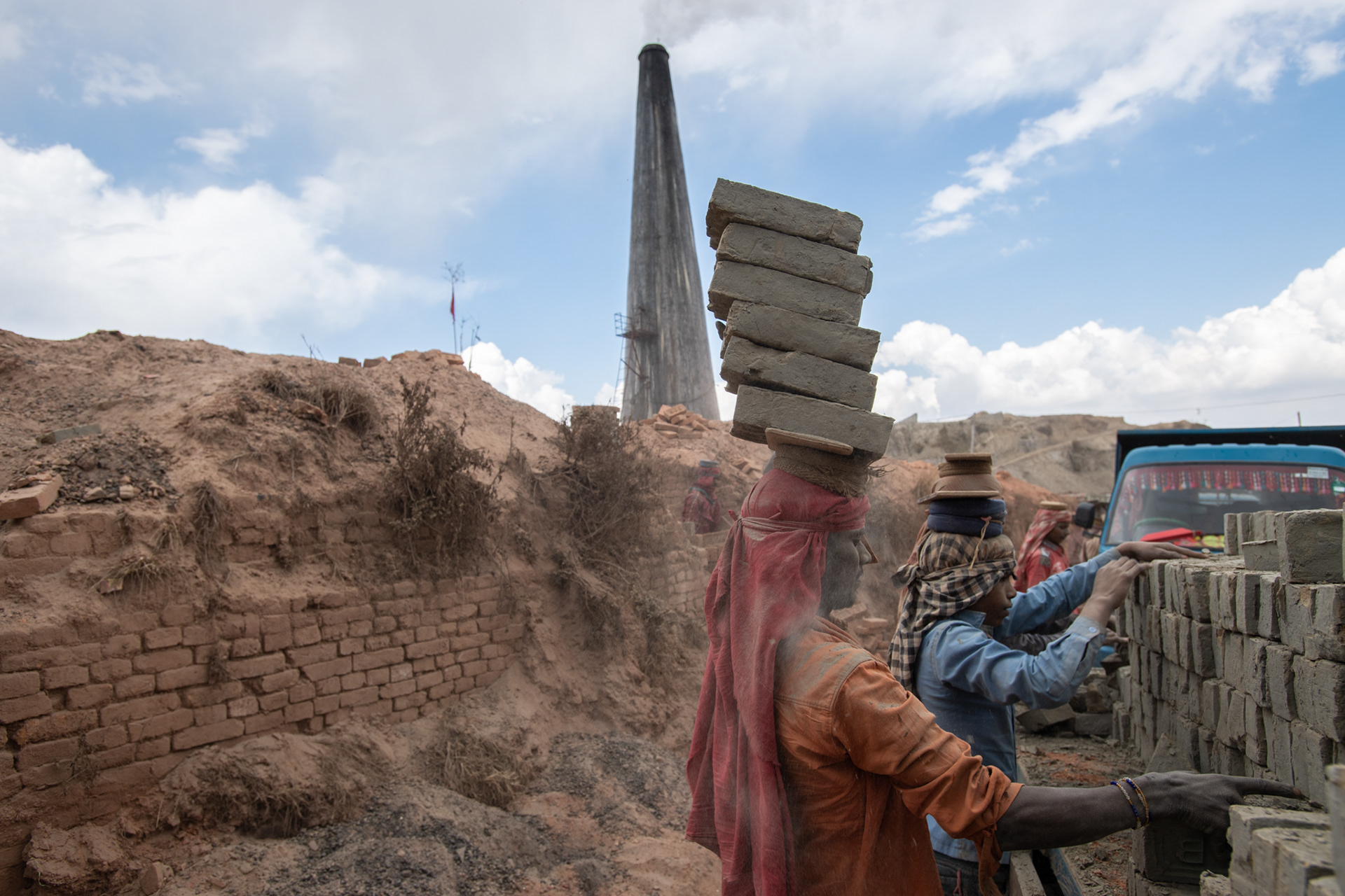 Sun dried bricks are hauled into the kiln.