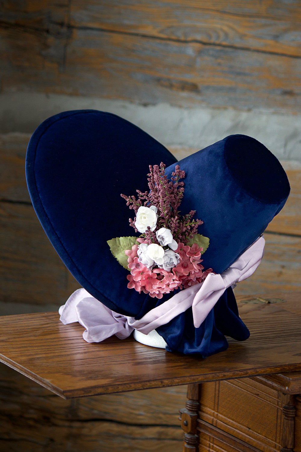 1830s Bonnet: Handmade Romantic Era Bonet in velvet decorated with a silk bow and modern decorative flowers.
