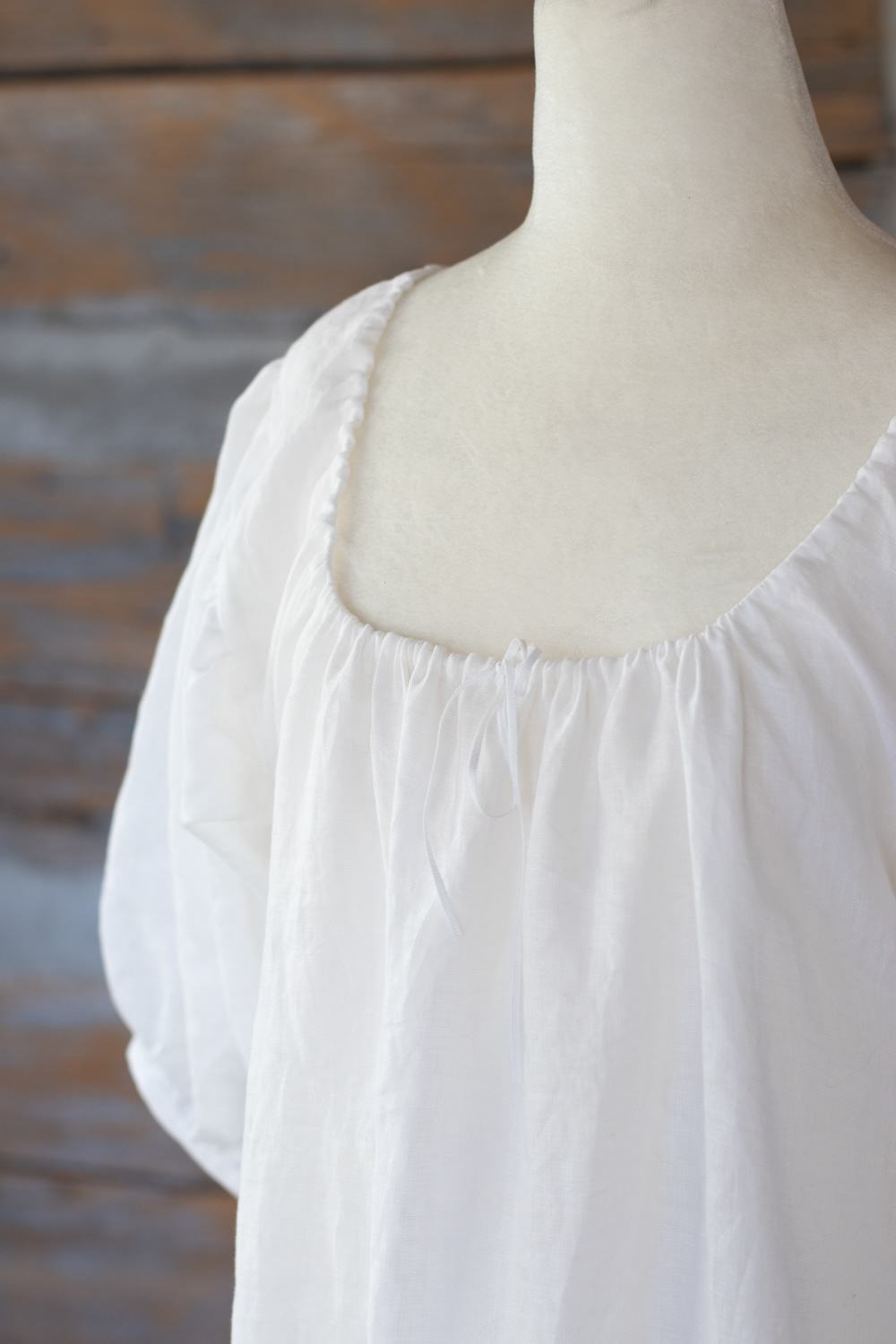 17th century linen chemise with drawstring neckline and gathered voluminous sleeves. Internal joins are french seams.