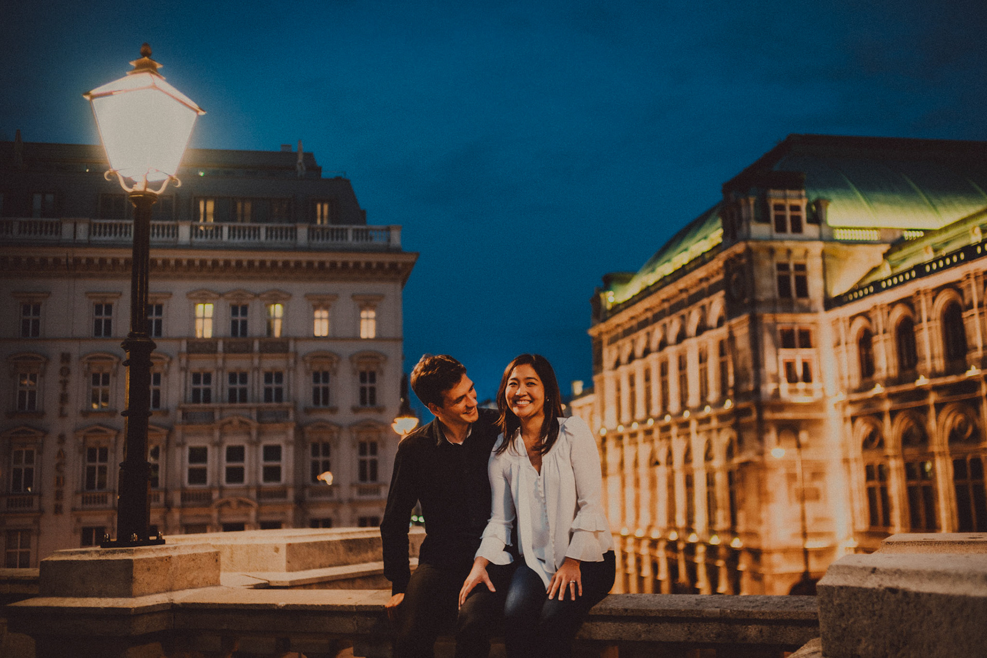Casual destination engagement photos inspired by "Before Sunrise" movie locations, Albertina Museum and Hotel Sacher at dusk, Innere Stadt, Vienna, Austria, August 2017, Sony A7RII.