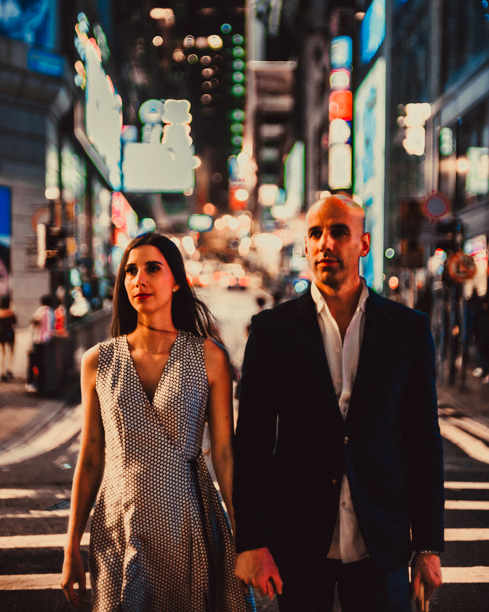 A moody, late night pre wedding photo shoot in Central Hong Kong with Eric and Sabrina. A reportage and street style set with a bystander in one of the Stanley Street's alleyways.