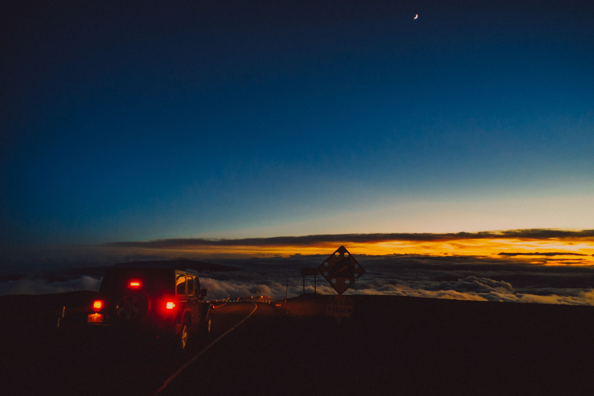 A jeep traversing Mauna Kea Access Road after sunset, Hawaii, USA, September 2015, Sony A7S.
