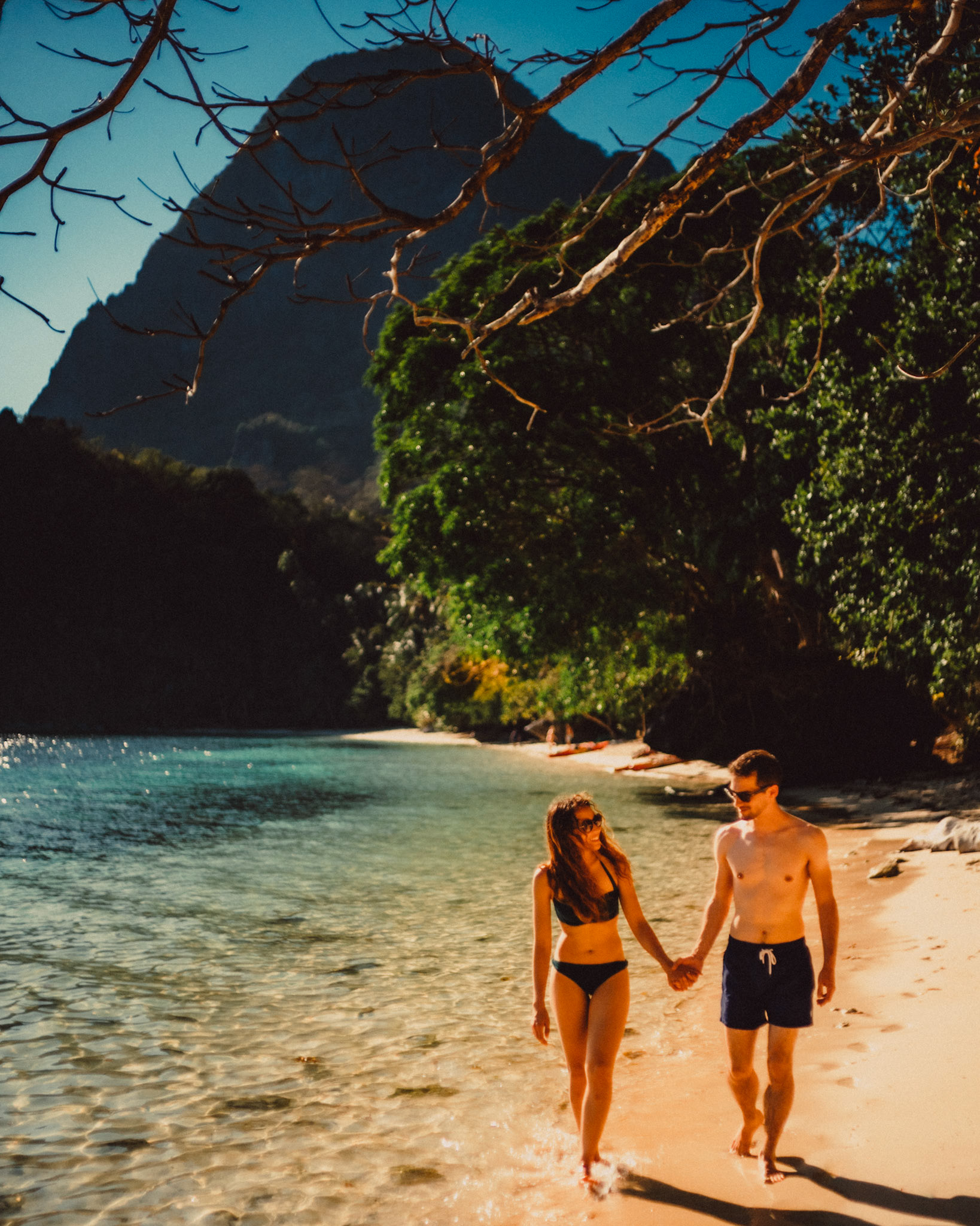 Candid and chill couple portraits in Paradise Beach, Cadlao Island, El Nido, Palawan, Philippines, Southeast Asia, April 2019, Sony A7III.