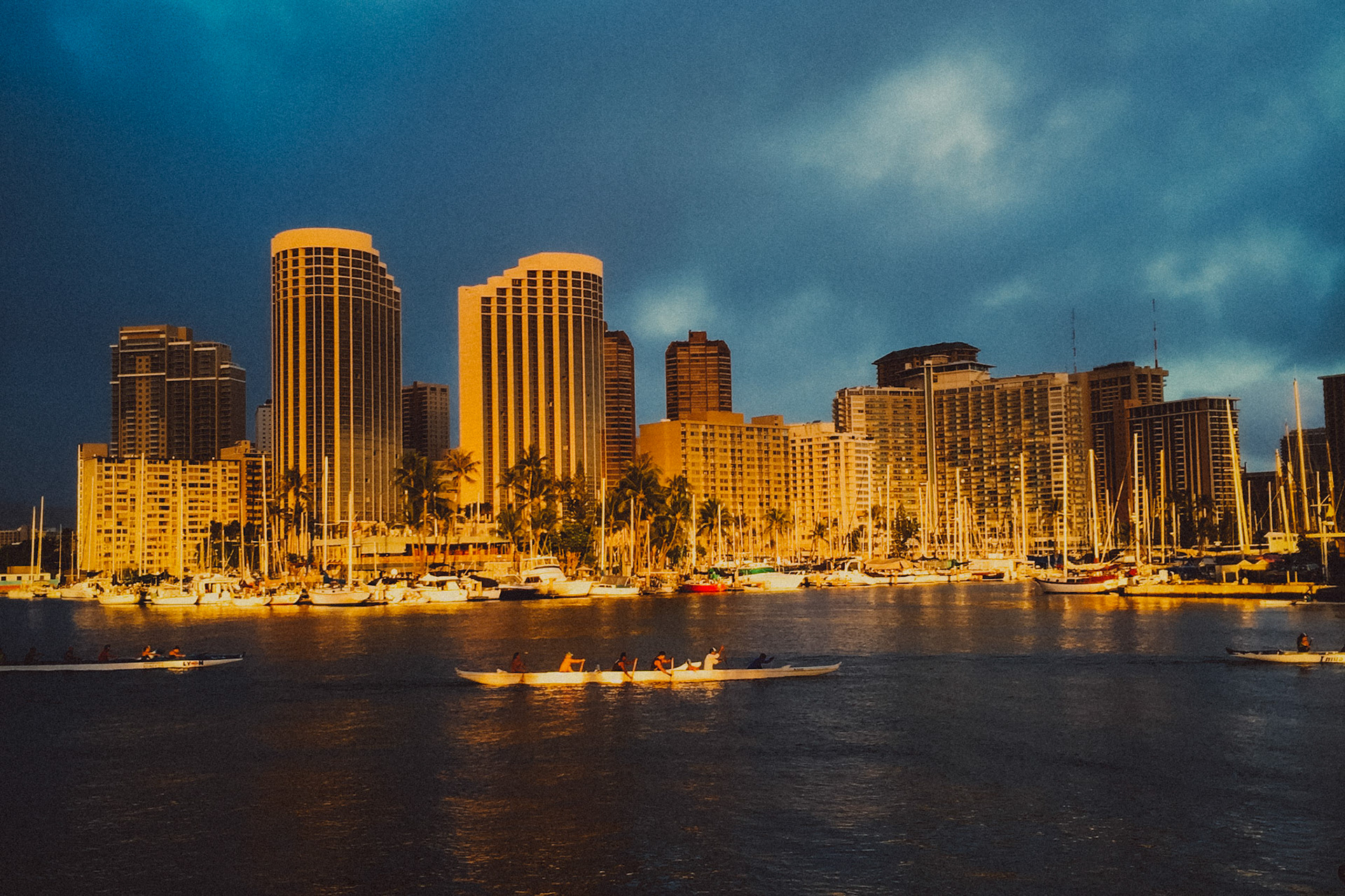 Ocean kayaking in front of Honolulu's sunlit waterfront, Hawaii, USA, September 2015, iPhone 6 Plus.