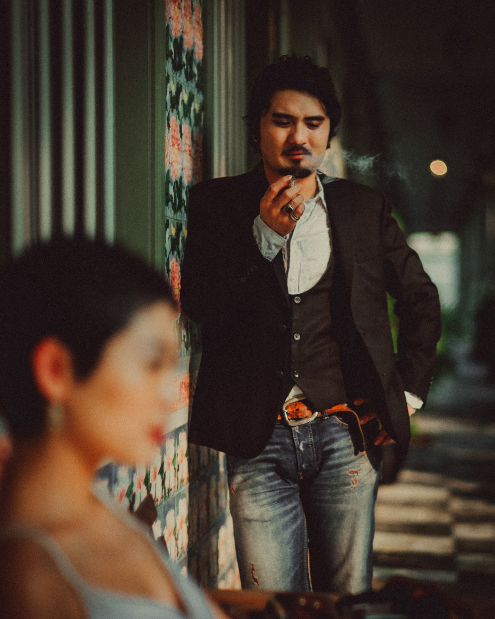 A Japanese couple sharing a lighthearted moment in a sunlit corridor with Peranakan details, from Ibuki and Emi's artsy moody engagement shoot, Pertain Road, Little India, Singapore, October 2015, Leica M.
