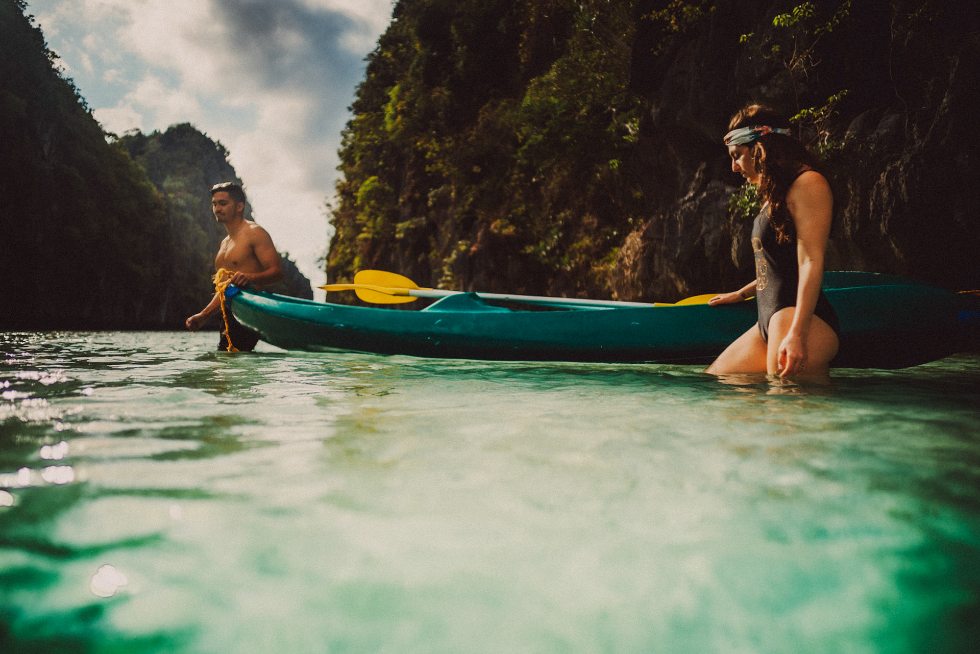 The couple wading waist-deep water in the Big Lagoon, from Peter &amp; Alexis' adventure engagement session in Miniloc Island, El Nido, Palawan, Philippines, Southeast Asia, April 2018, Sony A7SII