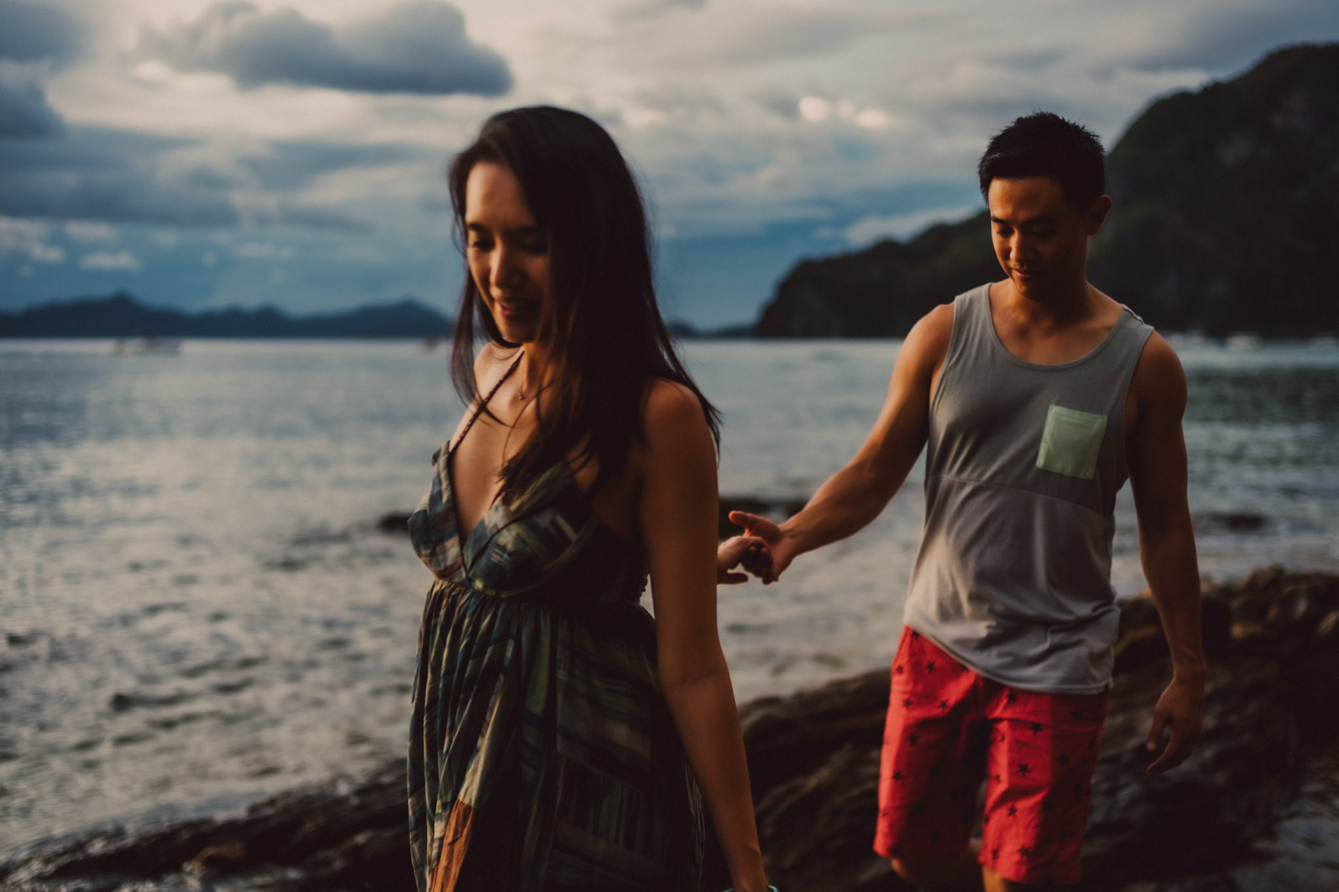 Blue hour couple portraits on a rocky coast, just below Republica Sunset Bar, from George and Allie's honeymoon portrait shoot, Corong-Corong Beach, El Nido, Palawan, Philippines, Southeast Asia, December 2018, Sony A7III