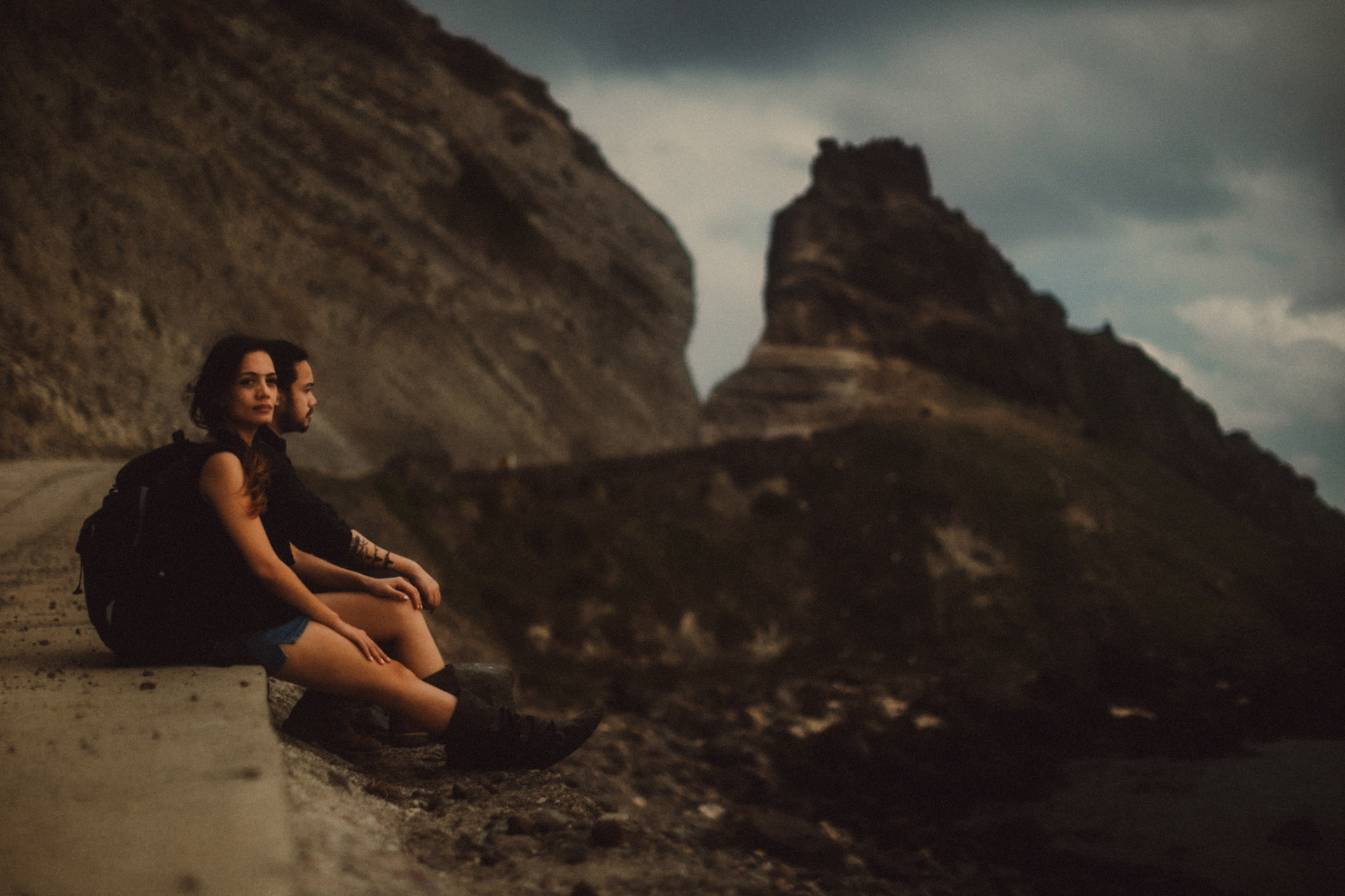 Moody backpacker adventure couple portraits at the Alapad Rock Formation, Batanes, Philippines, Southeast Asia, November 2014, Canon EOS 6D.