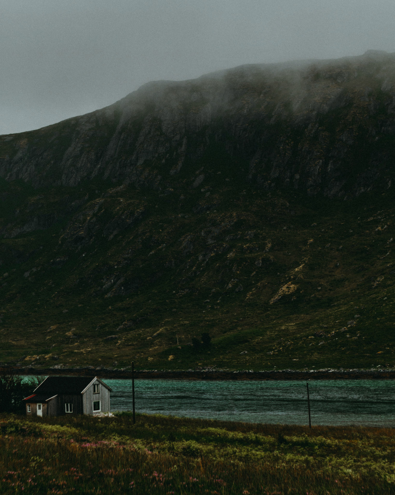 A Nordic cabin beside a stream and a rocky ridge, Lofoten Islands, Norway, July 2016, Sony A7RII.
