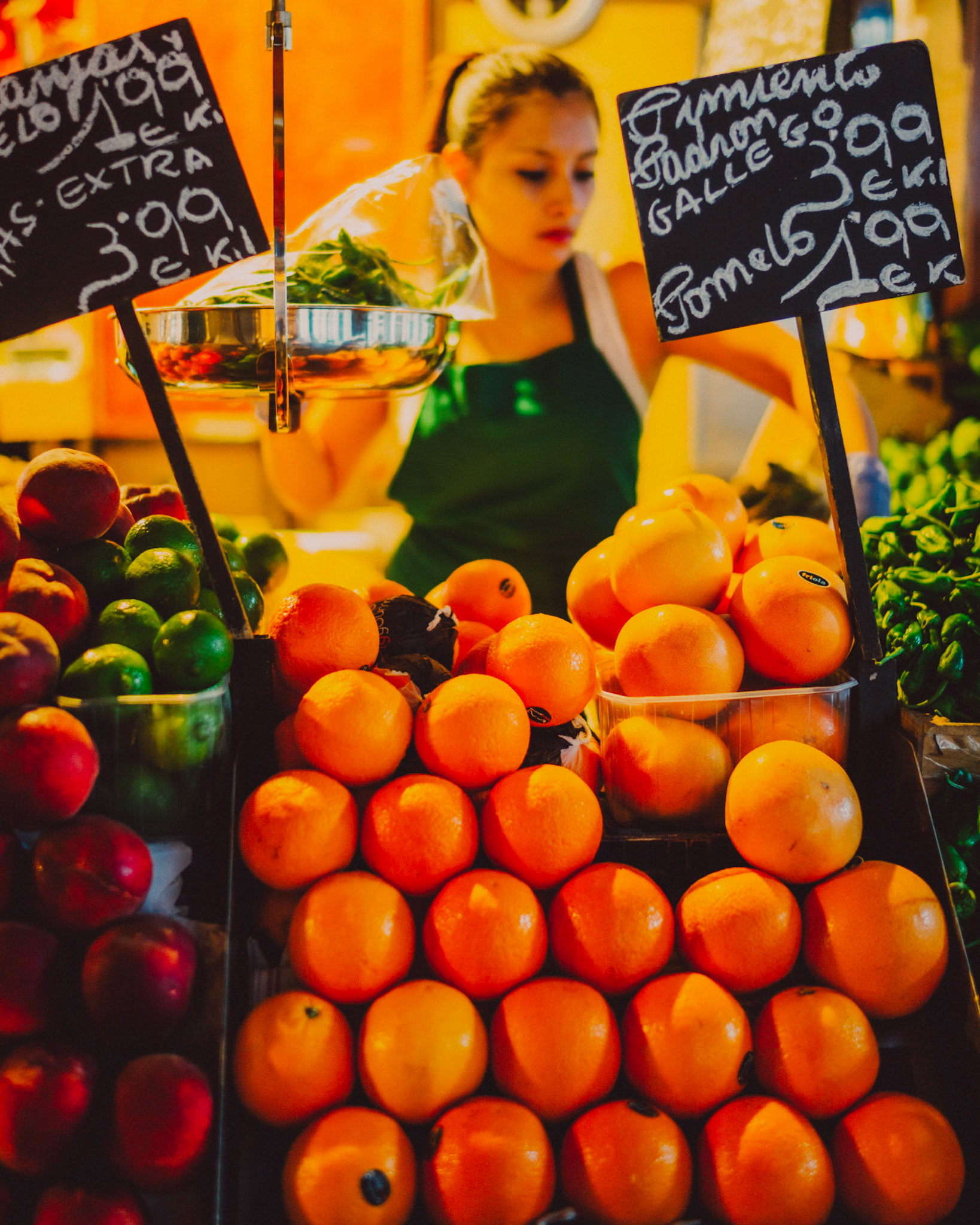 A fruit vendor selling oranges in Mercat de la Boqueria, Barcelona, Spain, July 2016, Leica M.