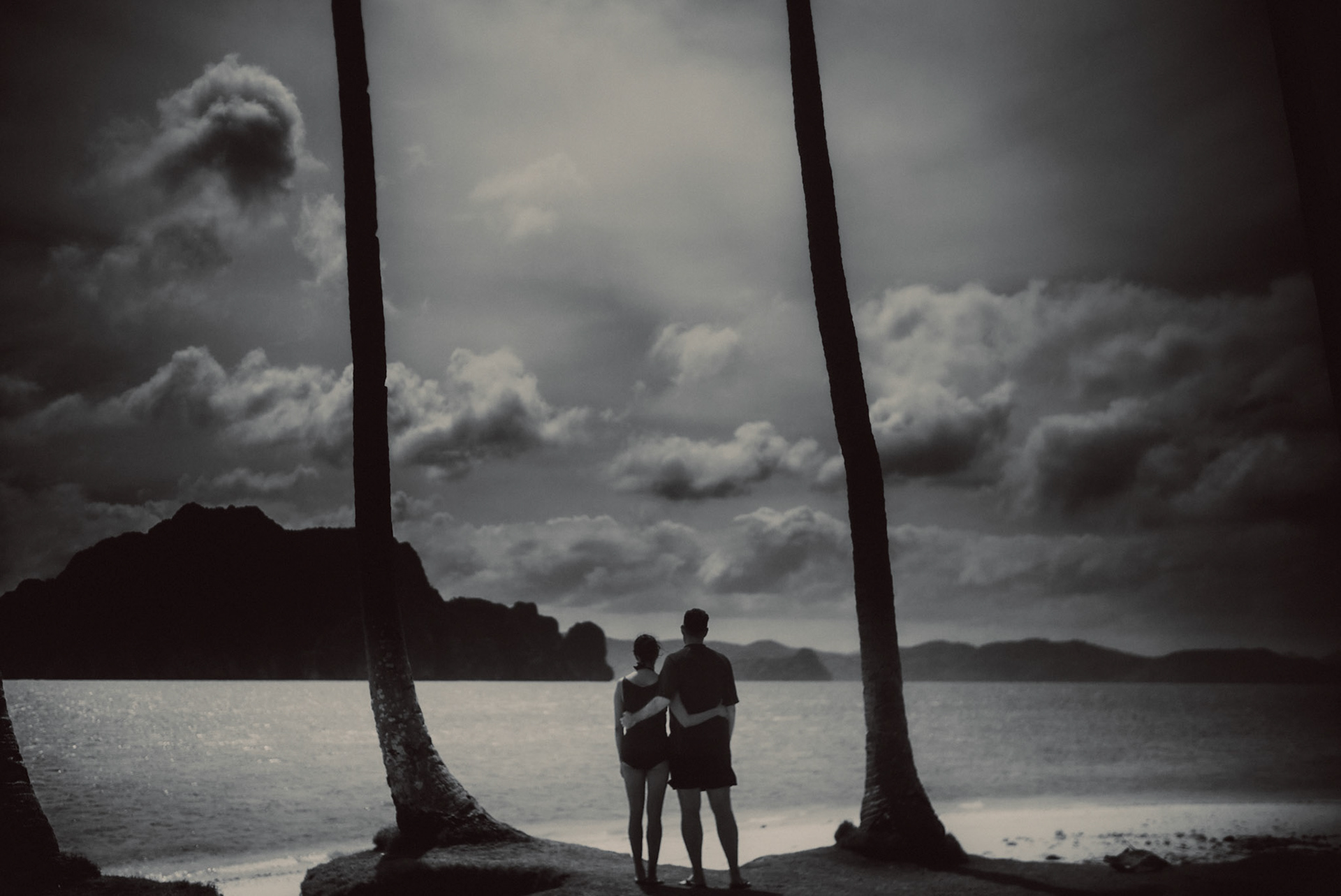 Moody island hopping couple portraits, in black and white, Pinagbuyutan Island, El Nido, Palawan, Philippines, Southeast Asia, January 2017, Leica M