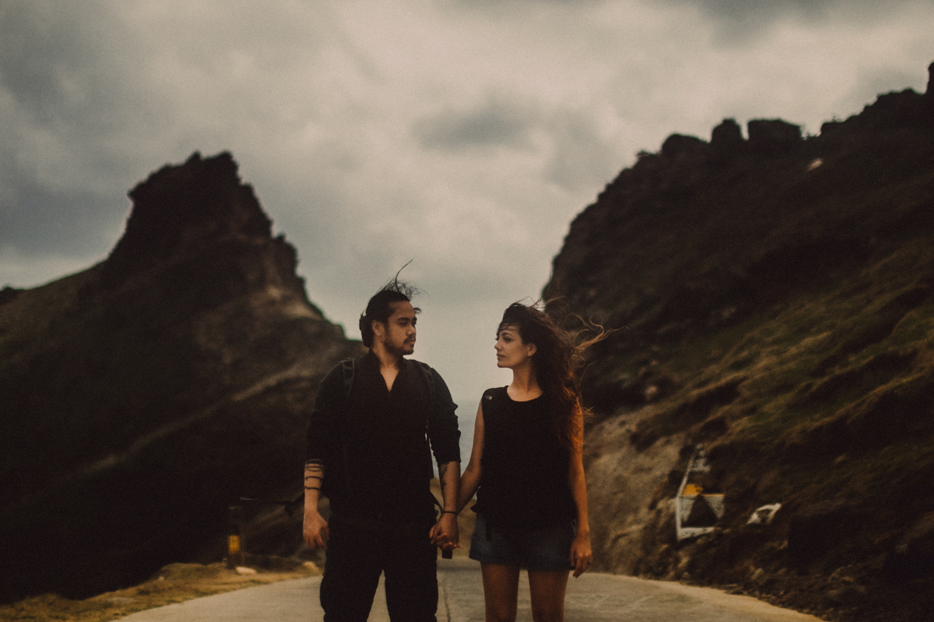 Backpacker adventure couple portraits at the Alapad Rock Formation, Batanes, Philippines, Southeast Asia, November 2014, Canon EOS 6D.
