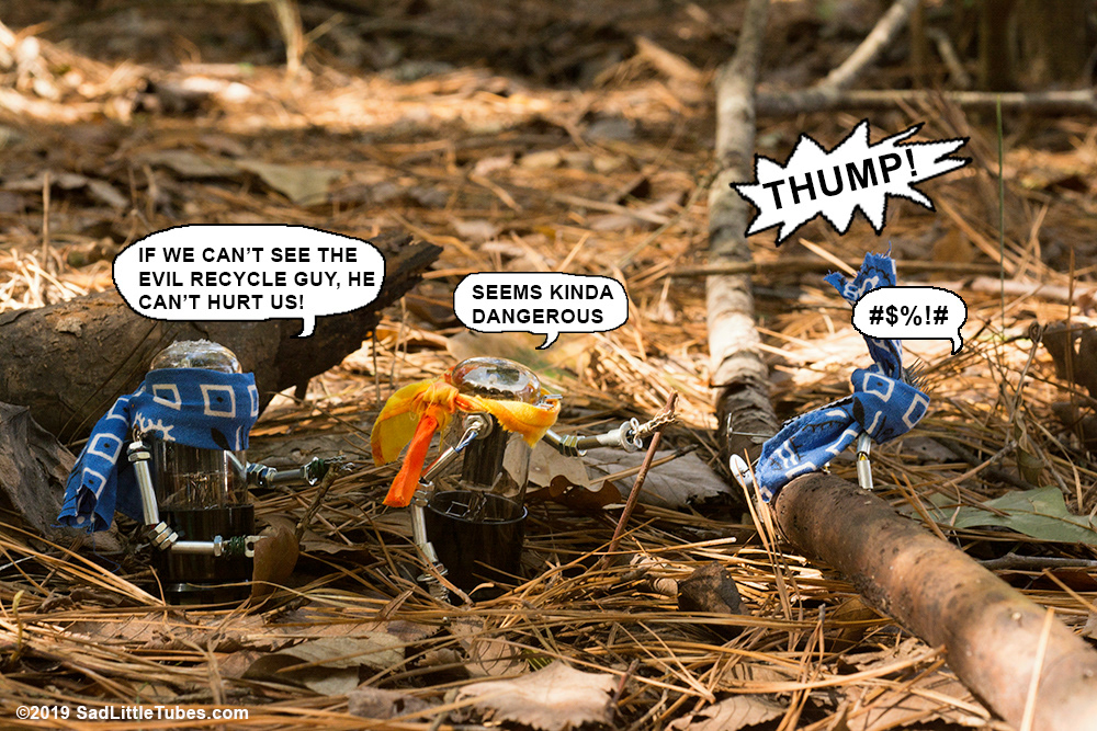 Blindfolded robot trips on log.