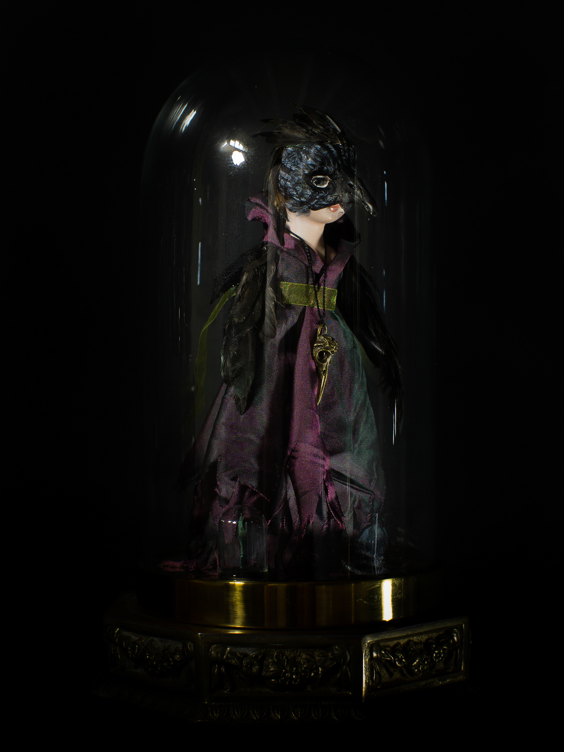 Changing Places - Vintage doll, clay, feathers, silk, various metals, glass and brass bell jar, antique brass base. 28 x 19