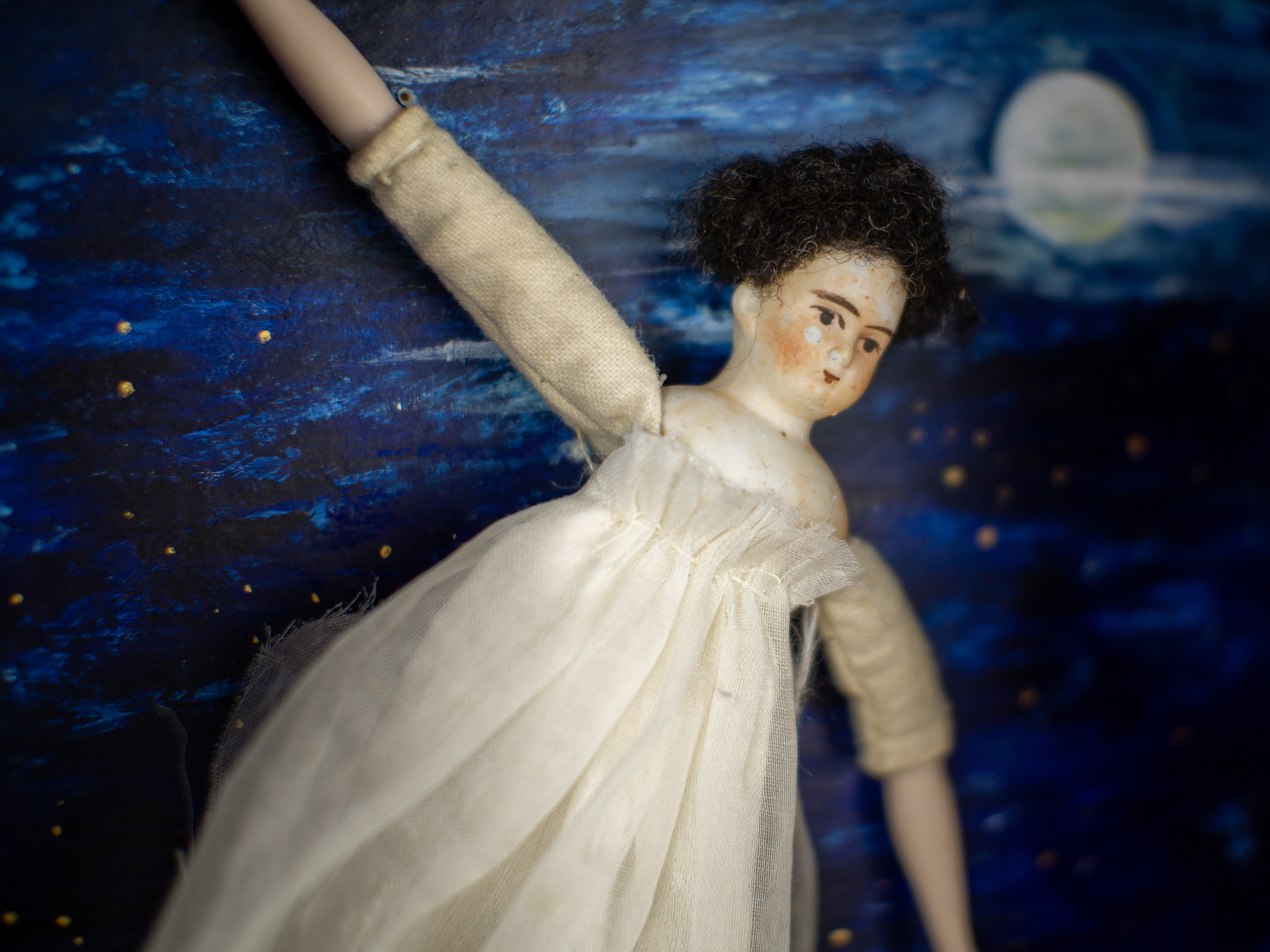 Learning To Fly - Antique wooden case, antique miniature bisque doll (German 1880), silk, clay, paint. 44 x 30 x 14