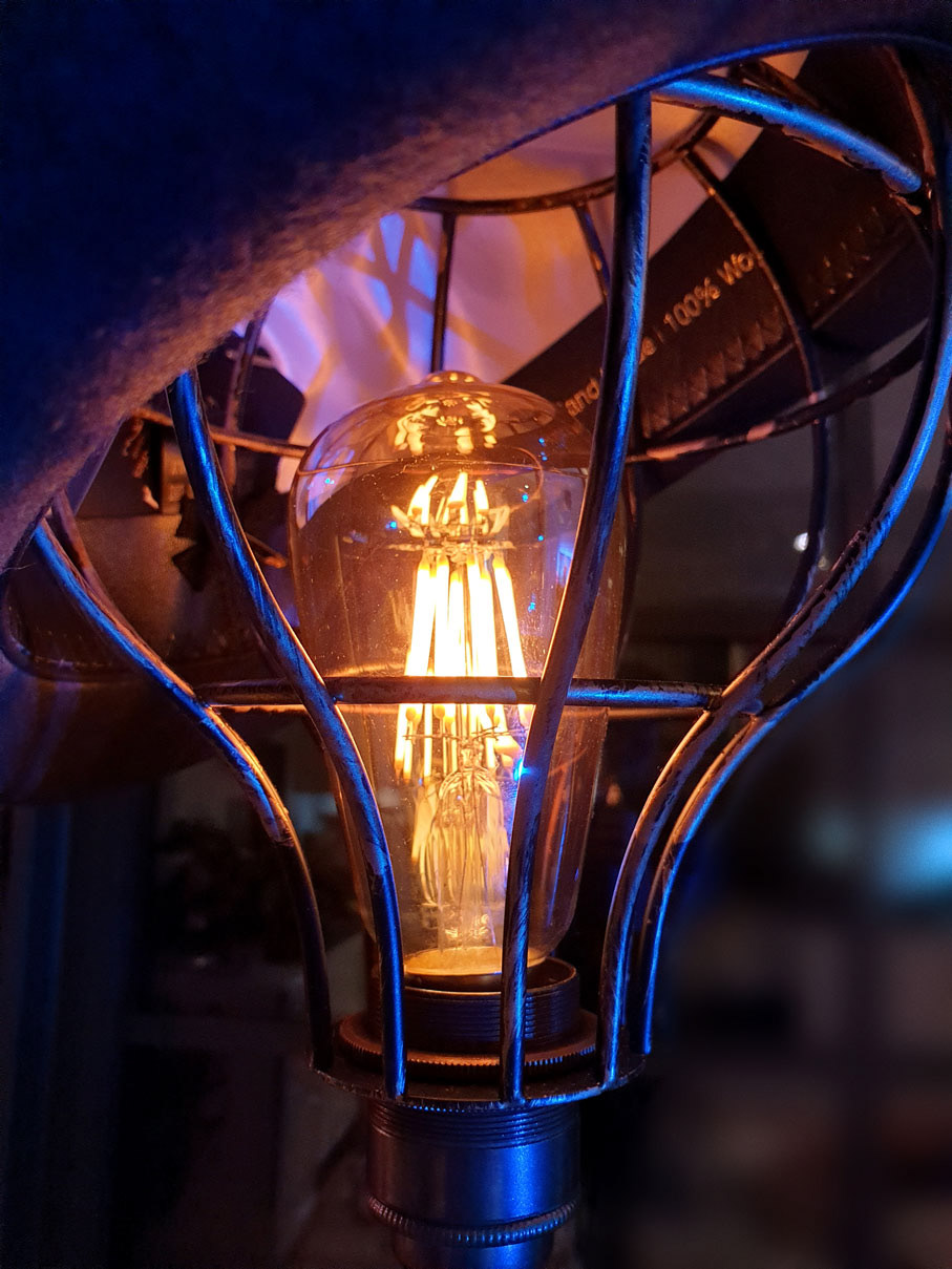 Vintage Edison light bulb inside a vintage bulb cage