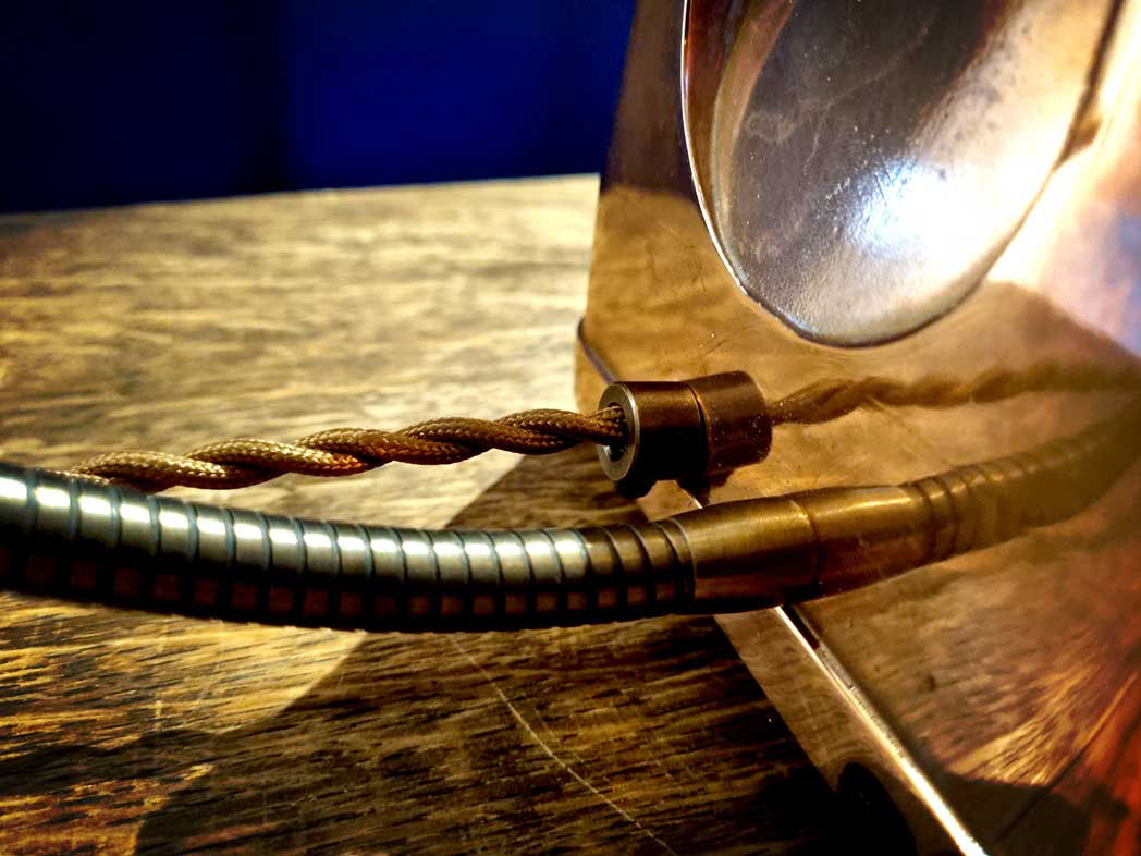 Antique metal cord grip with vintage braided cable