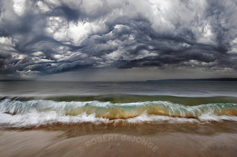 Sleeping bear bay, storm, angry clouds, wave, backlit