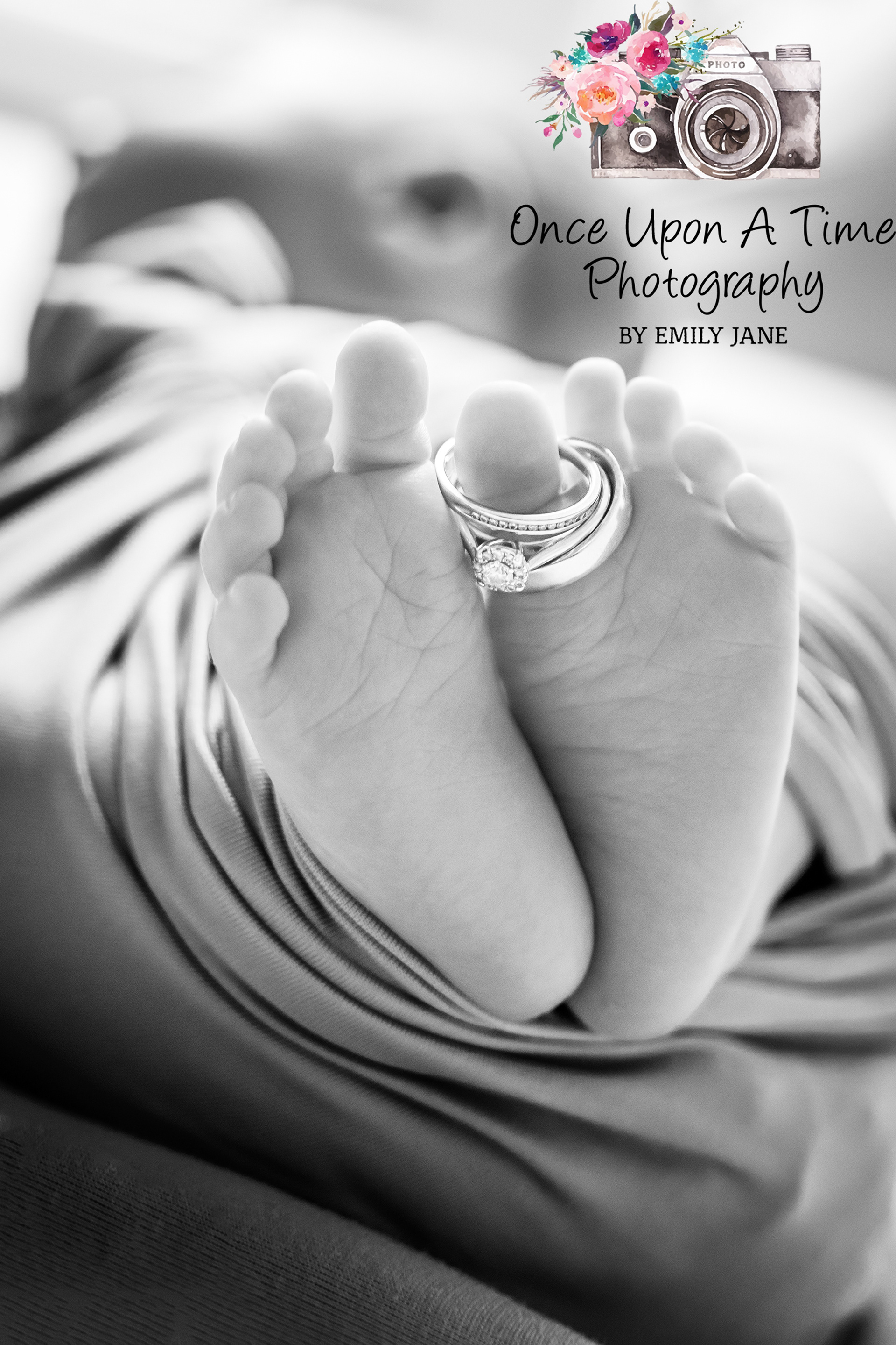 Newborn feet wedding rings