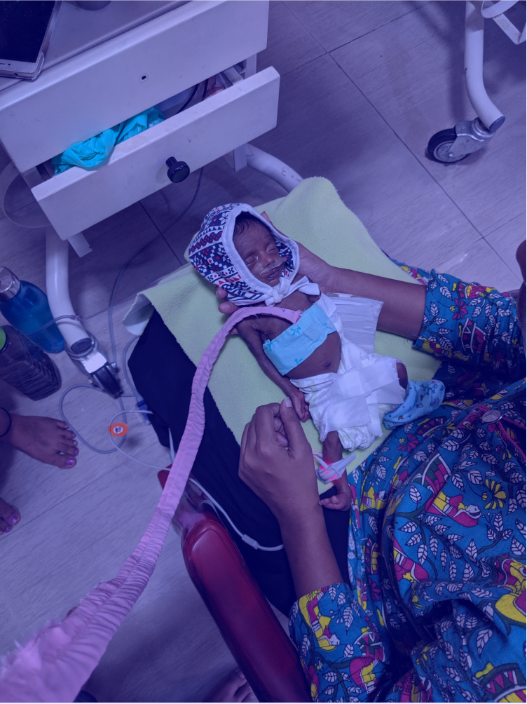 A baby in the NICU being monitored using the Carelet prototype