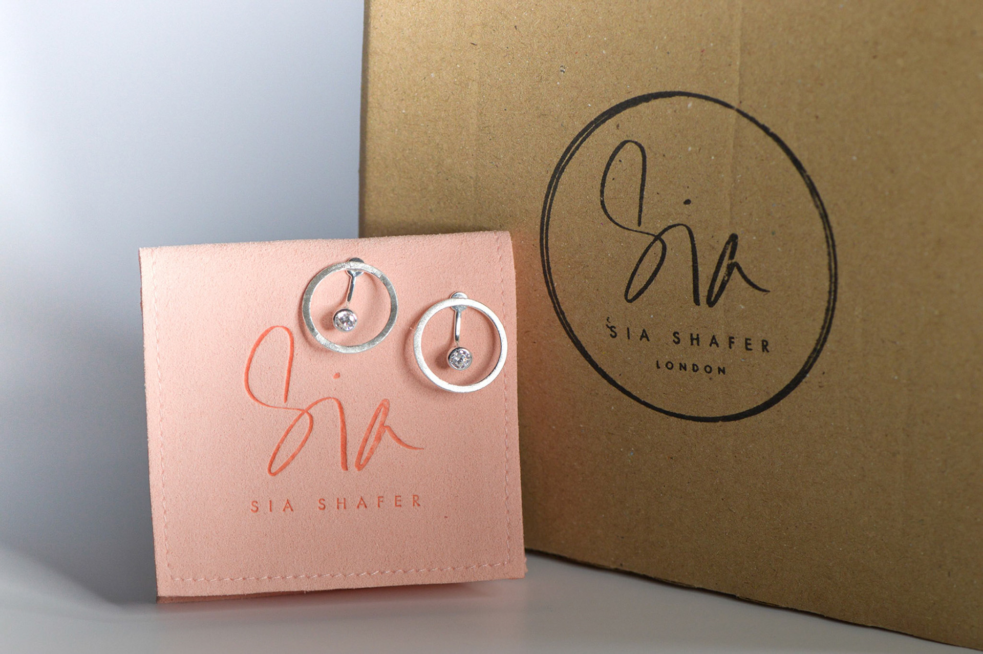 Sia shafer silver earrings on Branded packaging creative photography