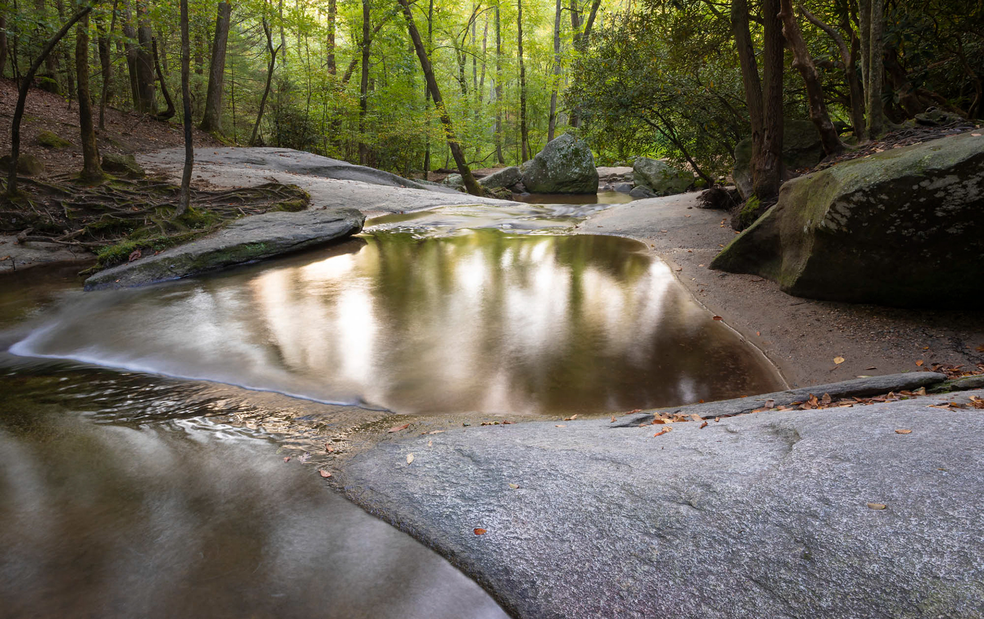 Stream running through Stone Mountain State Park by Guy Sagi