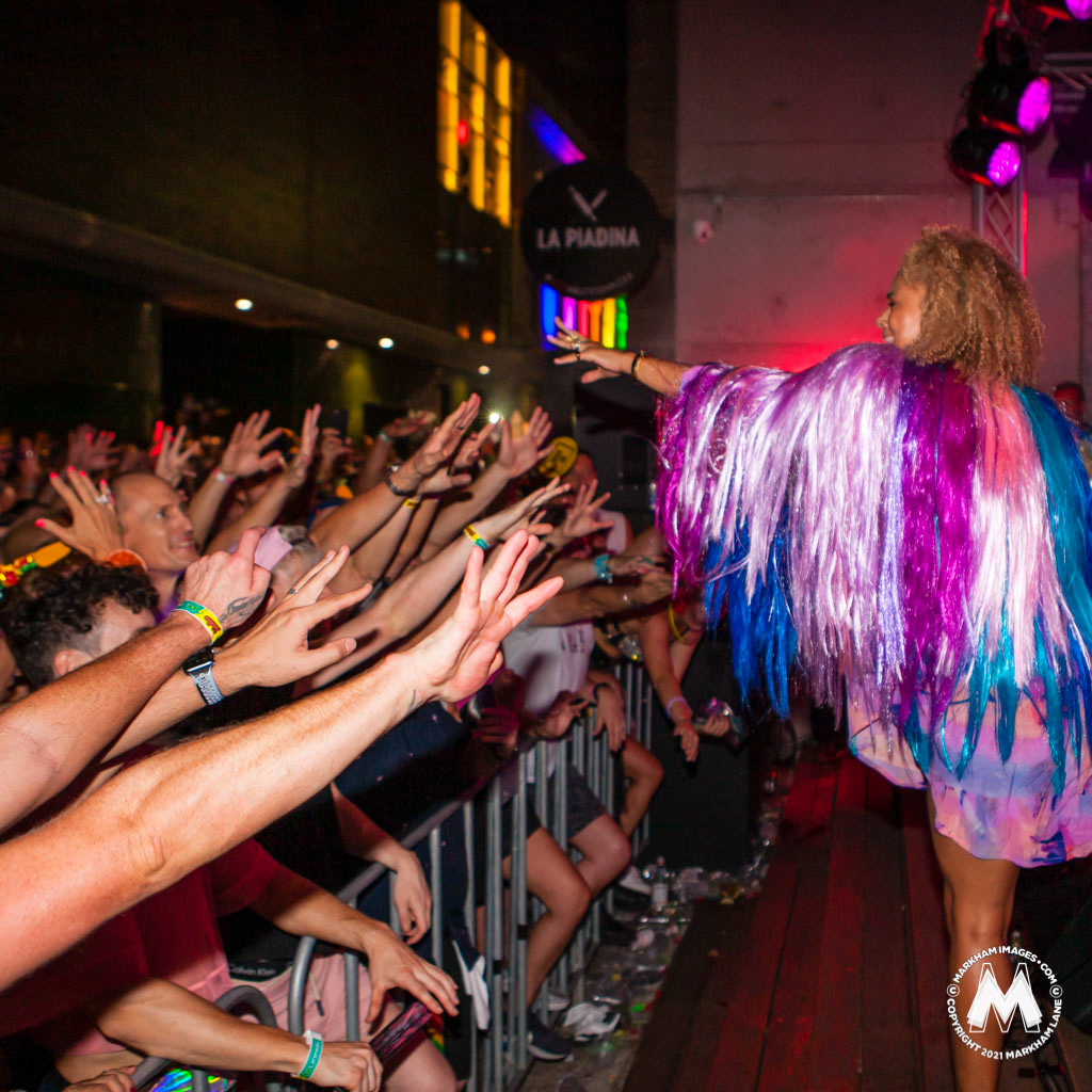 Miss Connie Mitchell from the Australian electronic band Sneaky Sound System whips the crowd into a frenzy during her 2019 Sydney Gay and Lesbian Mardi Gras Laneway performance. Photo by Markham Lane.