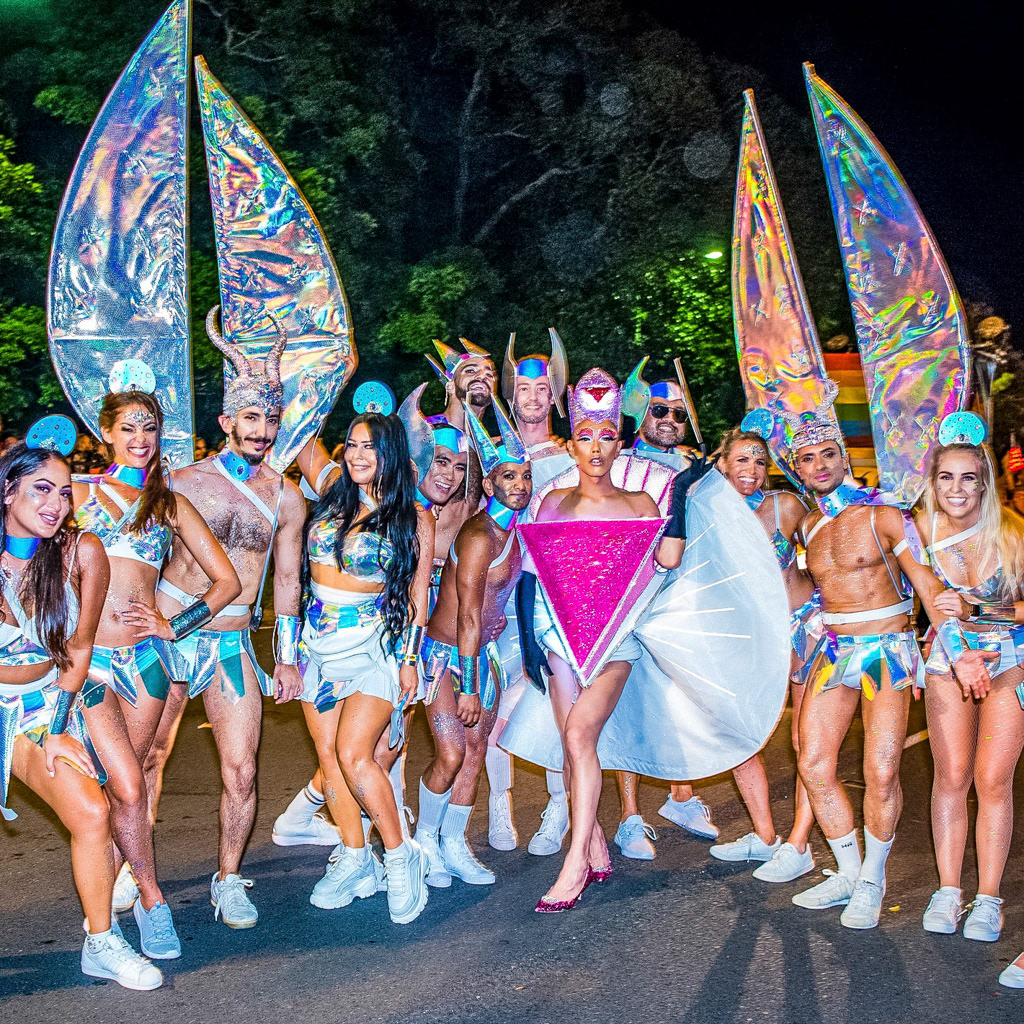 Across the finish line, team Aurora at the front of the Colours of Our Community float, captured by photographer Dac Nguyen at the conclusion of the 2019 Sydney Mardi Gras Parade.