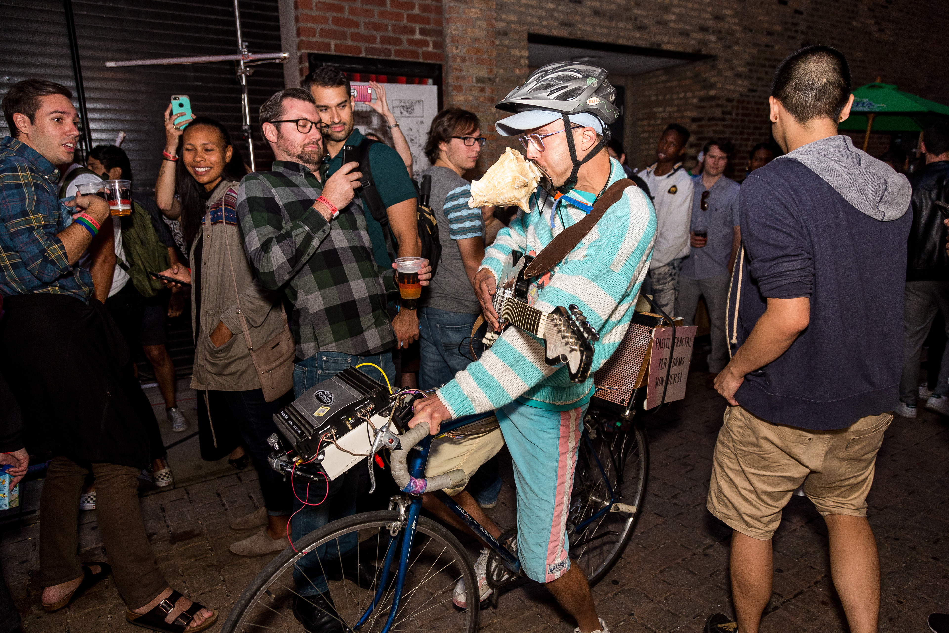 Conch Shell rides his mobile DJ set through the crowd.