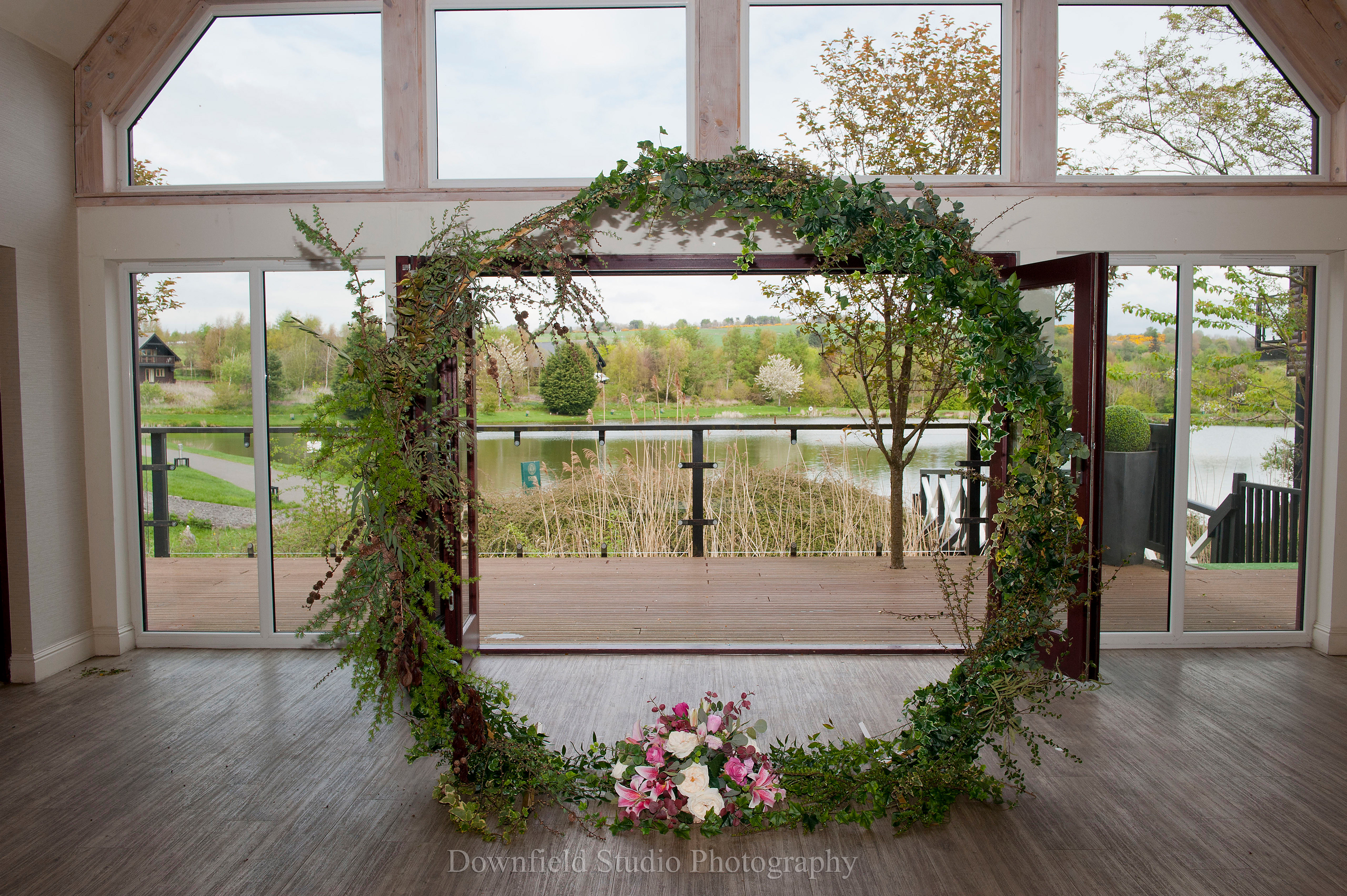 Fresh & faux foliage decoration of Moon Gate Arch with lower floral design