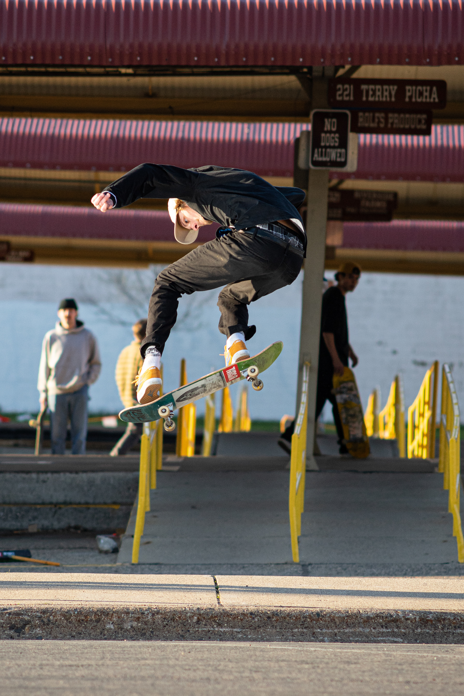 Mikey Carter - Backside Flip street kicker over sidewalk