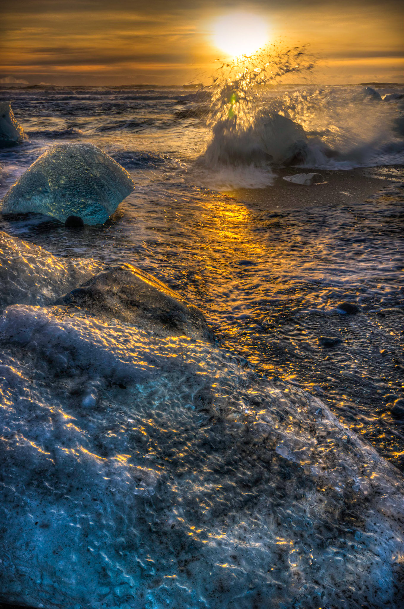 Sunrise at the ice beach at the outlet of Jökullsárlón.Austurland, IcelandFebruary 2, 2016This is an HDR image consisting of 5 exposures merged in Photomatix Pro. Additional processing in Lightroom and Photoshop.PENTAX K-3, Sigma 10-20mm f/4-5.6 EX DCISO 100 20 mm  ¹⁄₅₀ sec at ƒ / 18