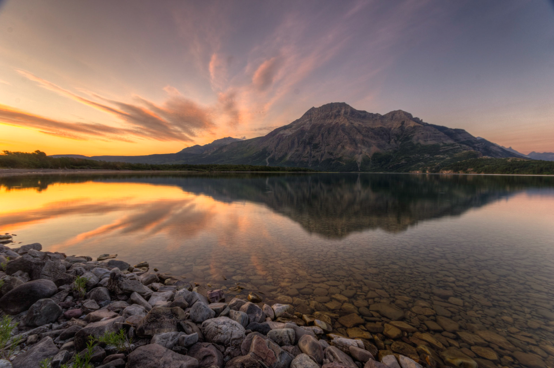 Sunrise over Middle Waterton Lake and Mount Vimy.Waterton Lakes National ParkAugust 2, 2015This is an HDR image consisting of 5 exposures merged in Photomatix Pro. Additional processing in Lightroom and Photoshop.PENTAX K-3, Sigma 10-20mm f/4-5.6 EX DCISO 100 10 mm  1.3 sec at ƒ / 11