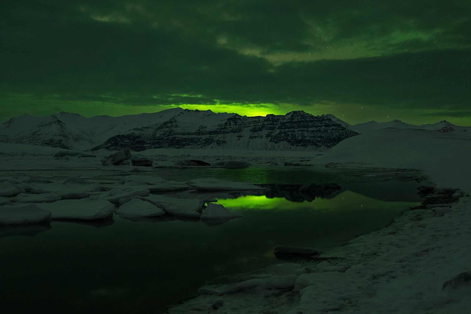 The Northern Lights mostly hidden by clouds over Jökulsárlón.JökulsárlónAusturland, IcelandFebruary 9, 2016PENTAX K-3, Sigma 18-35mm f/1.8 DC HSM ArtISO 640 18 mm  15.0 sec at ƒ / 1.8