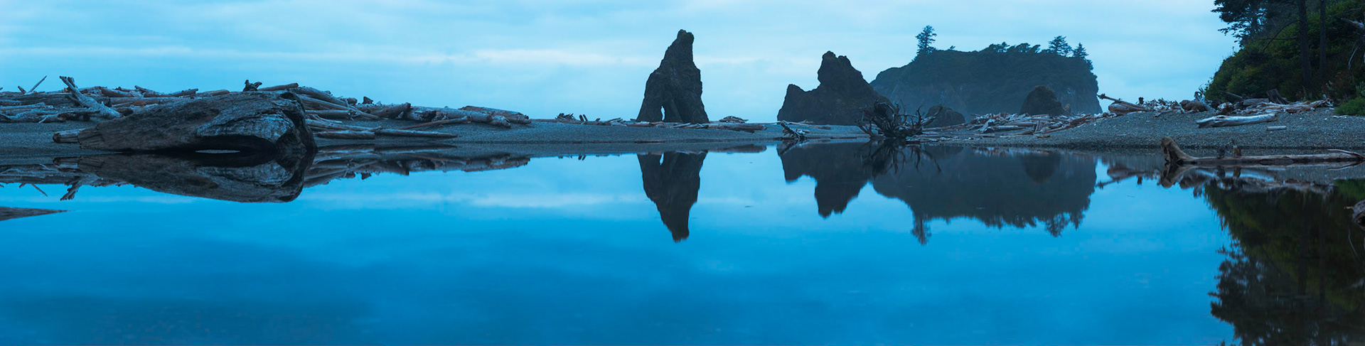 The tidal lagoon next to Ruby Beach, a bit before sunrise.Olympic National ParkWashingtonAugust 3, 2016This is a panoramic images consisting of 6 frames stitched in Photoshop. Additional processing in Lightroom and Photoshop.PENTAX K-1, TAMRON 28-300mm F3.5-6.3 Ultra zoom XRISO 800 100 mm  6.0 sec at ƒ / 8.0