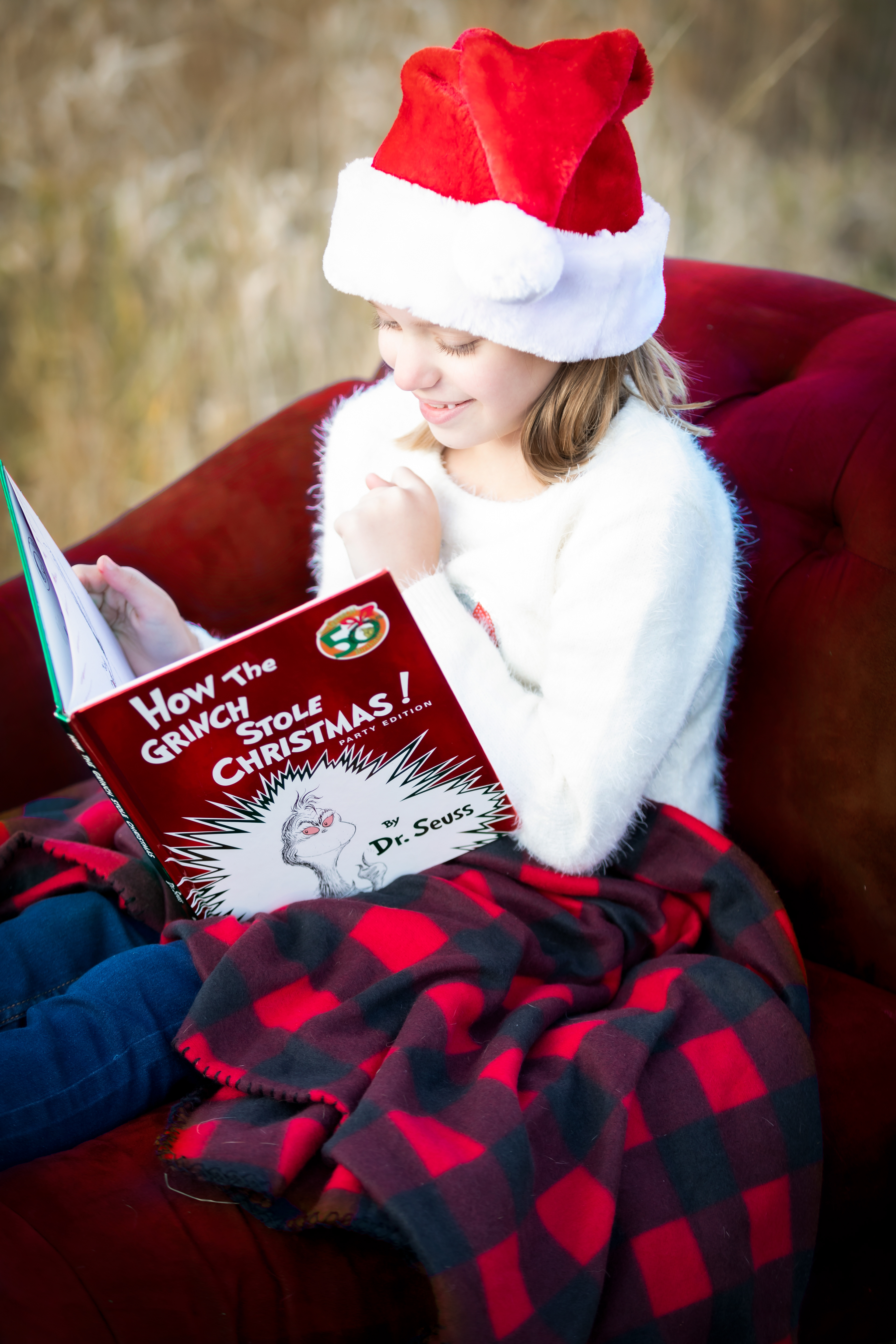 little girl reading a book