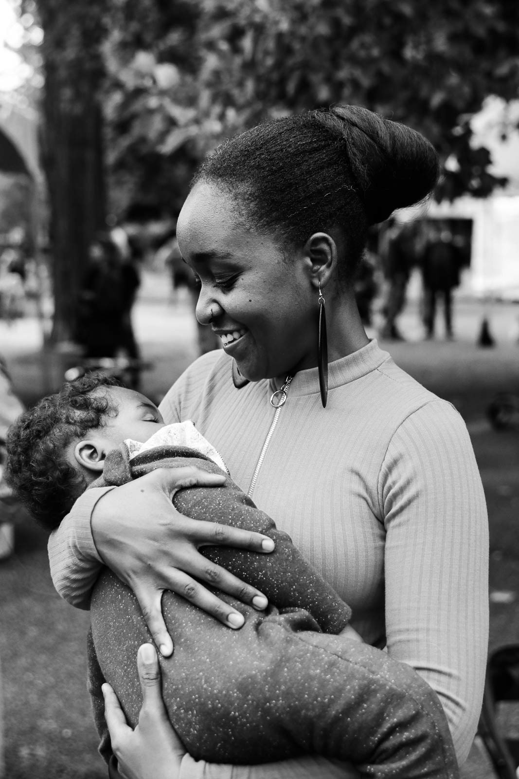 Mother holding baby in her arms for family portrait