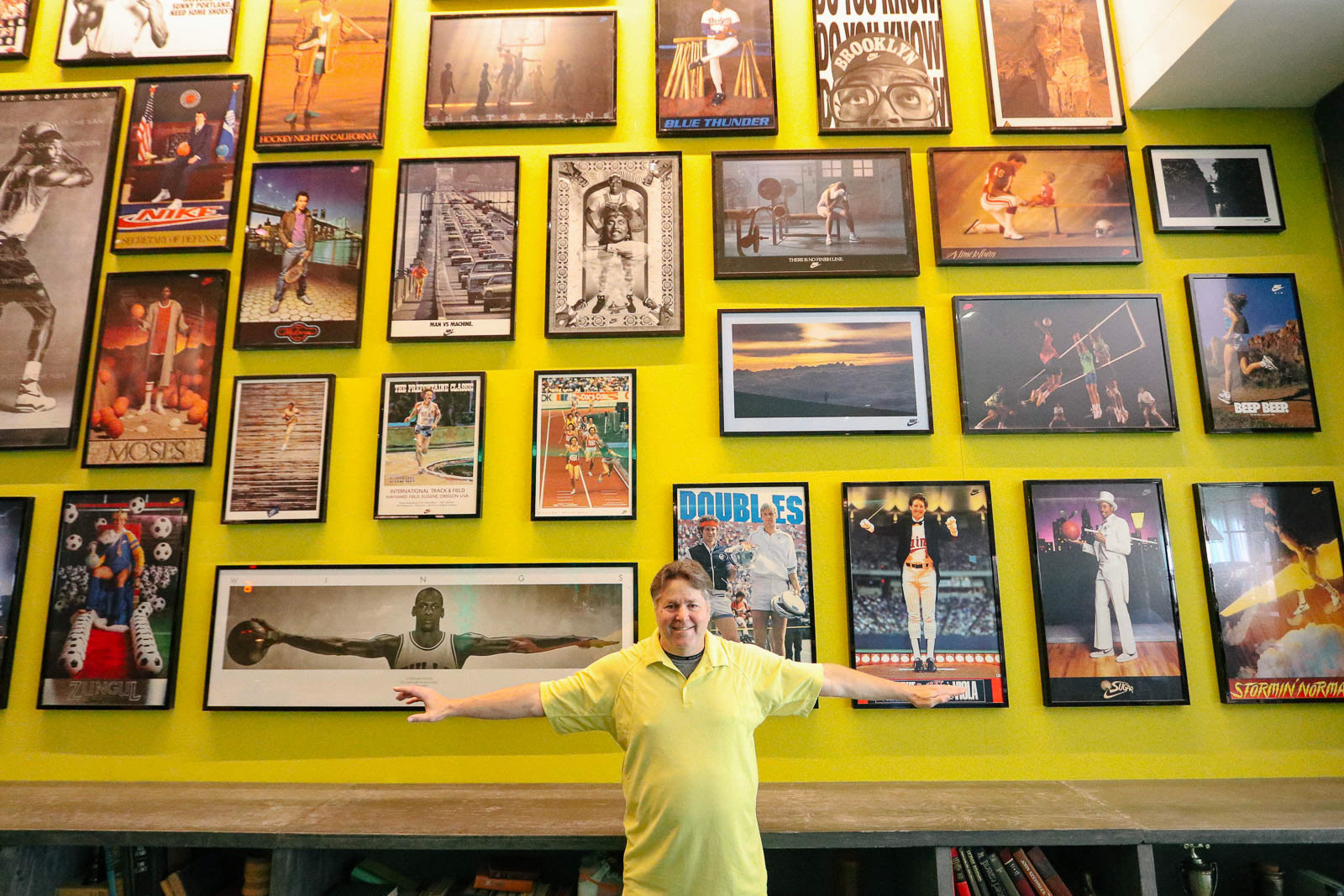The Graduate Eugene lobby wall covered in sports posters