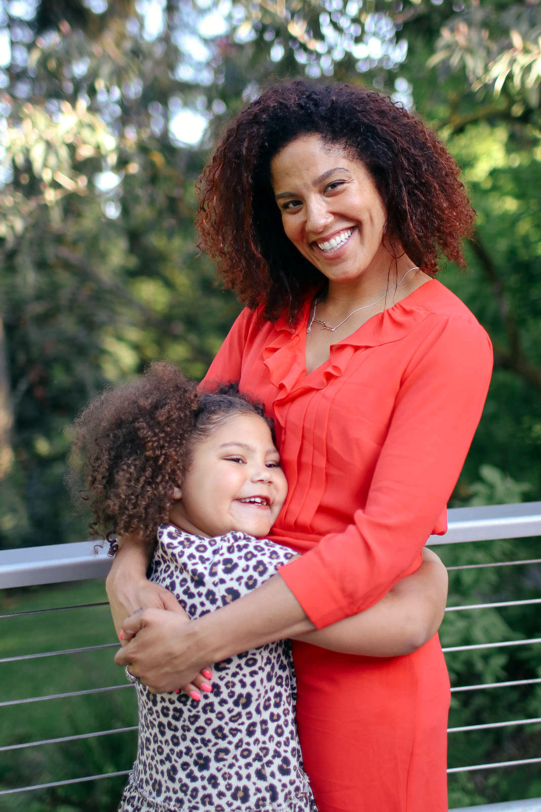 Happy mother and daughter hugging each other