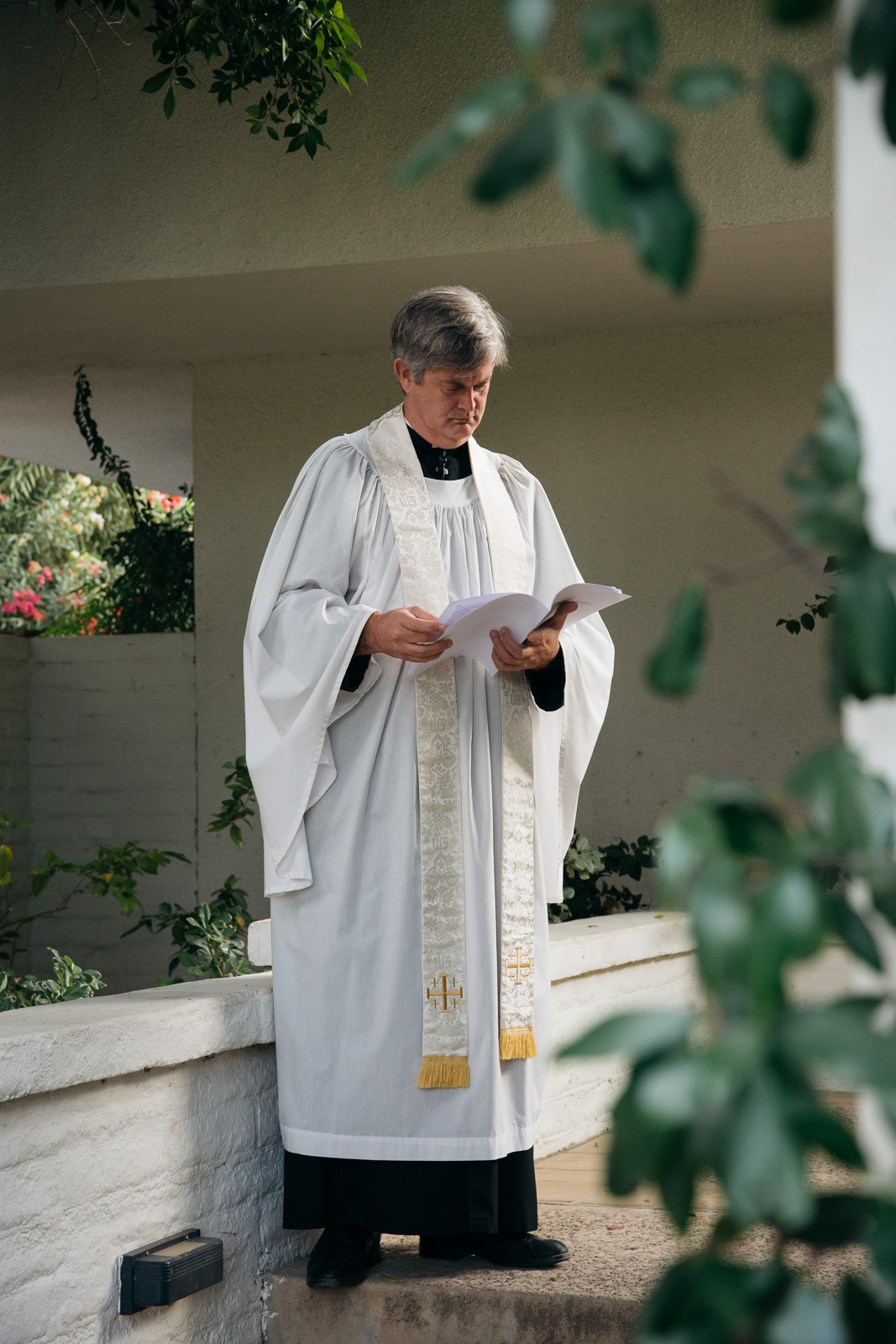 Catholic priest preparing for wedding ceremony
