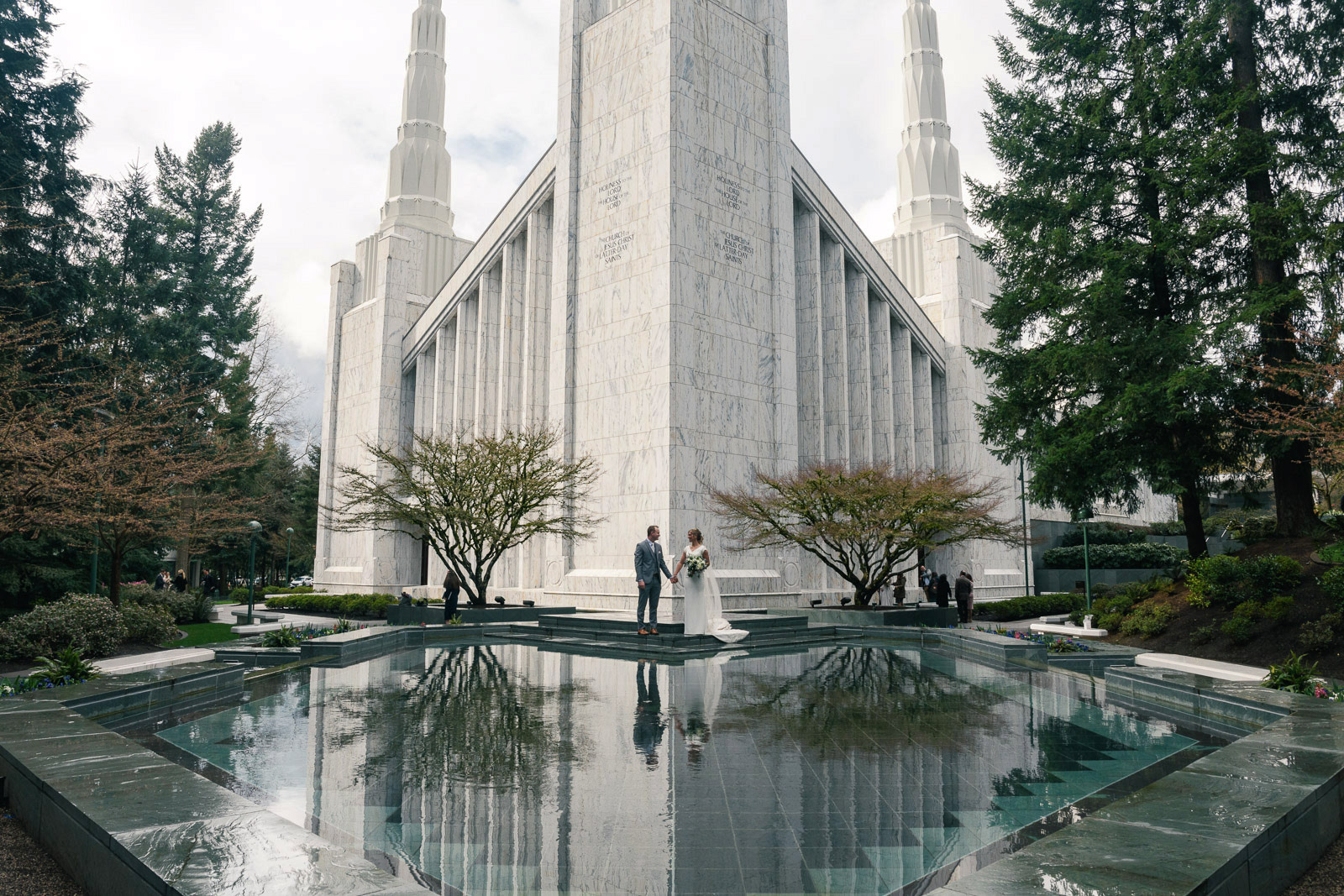 Wedding couple at reflecting pool at the Portland Oregon Temple