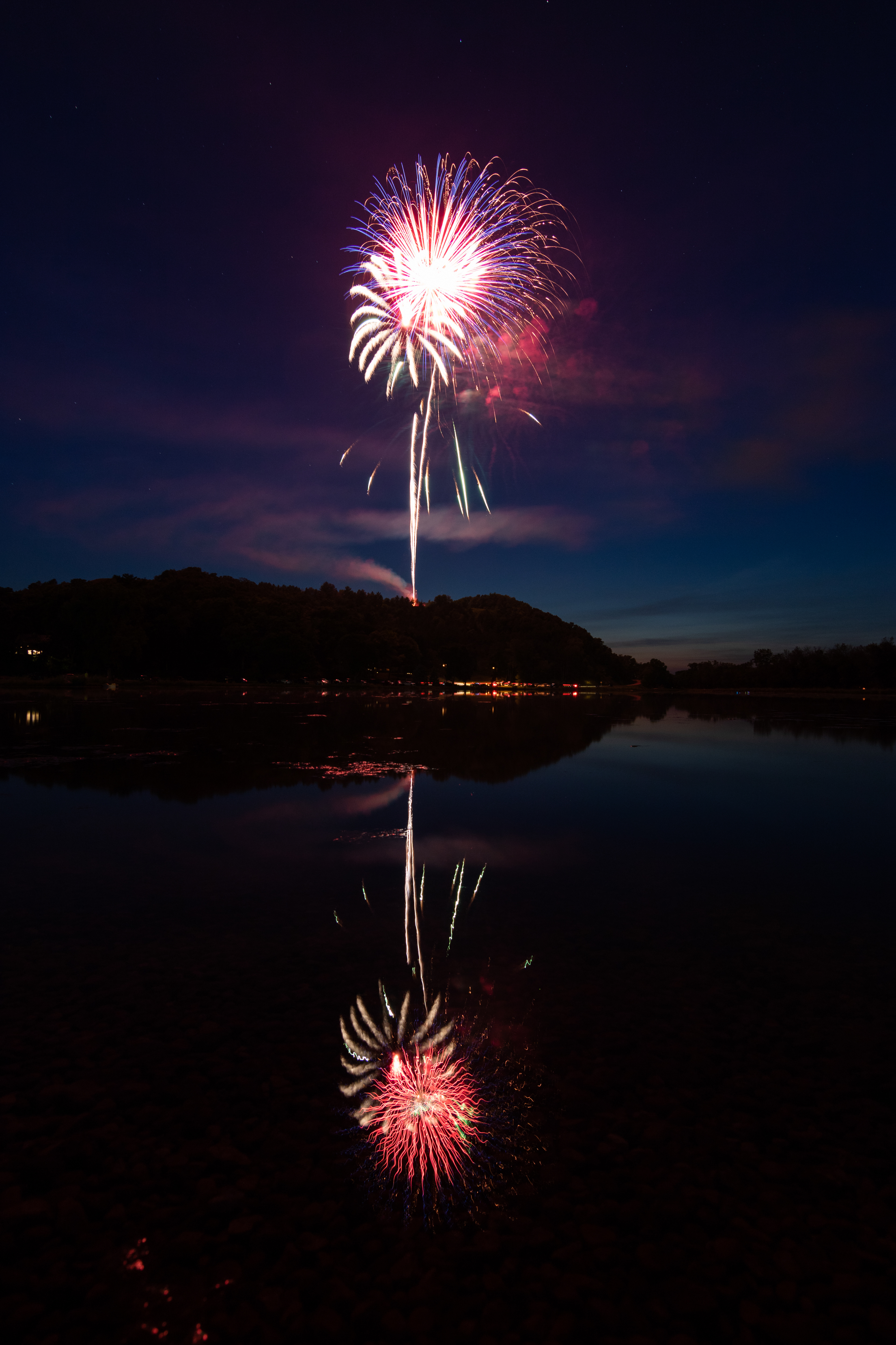 Fireworks being shot off the Bluff reflect in the water of Lake Marion. July 4, 2020.