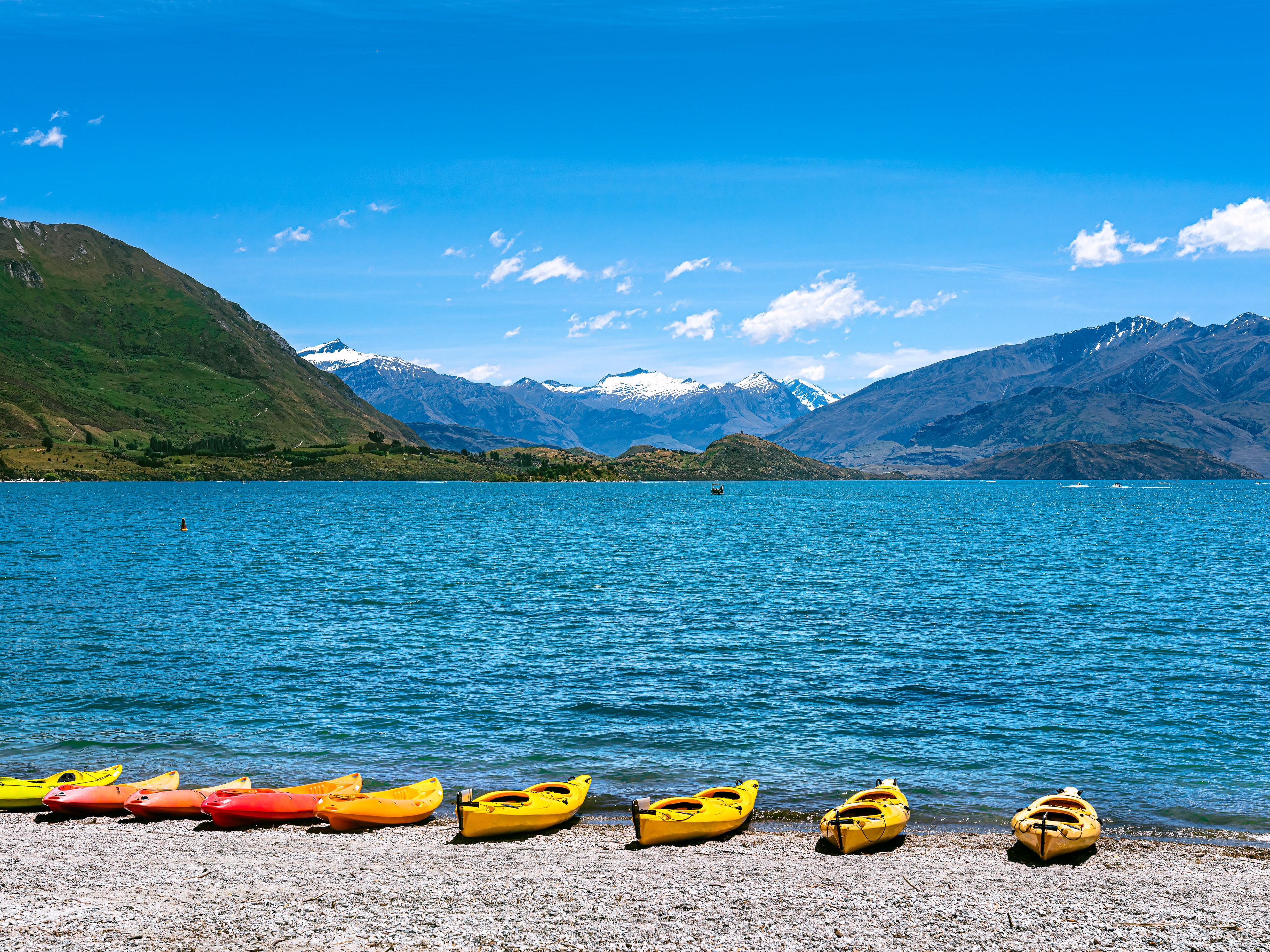 Kayaks at lakeshore of Lake Wanaka, New Zealand