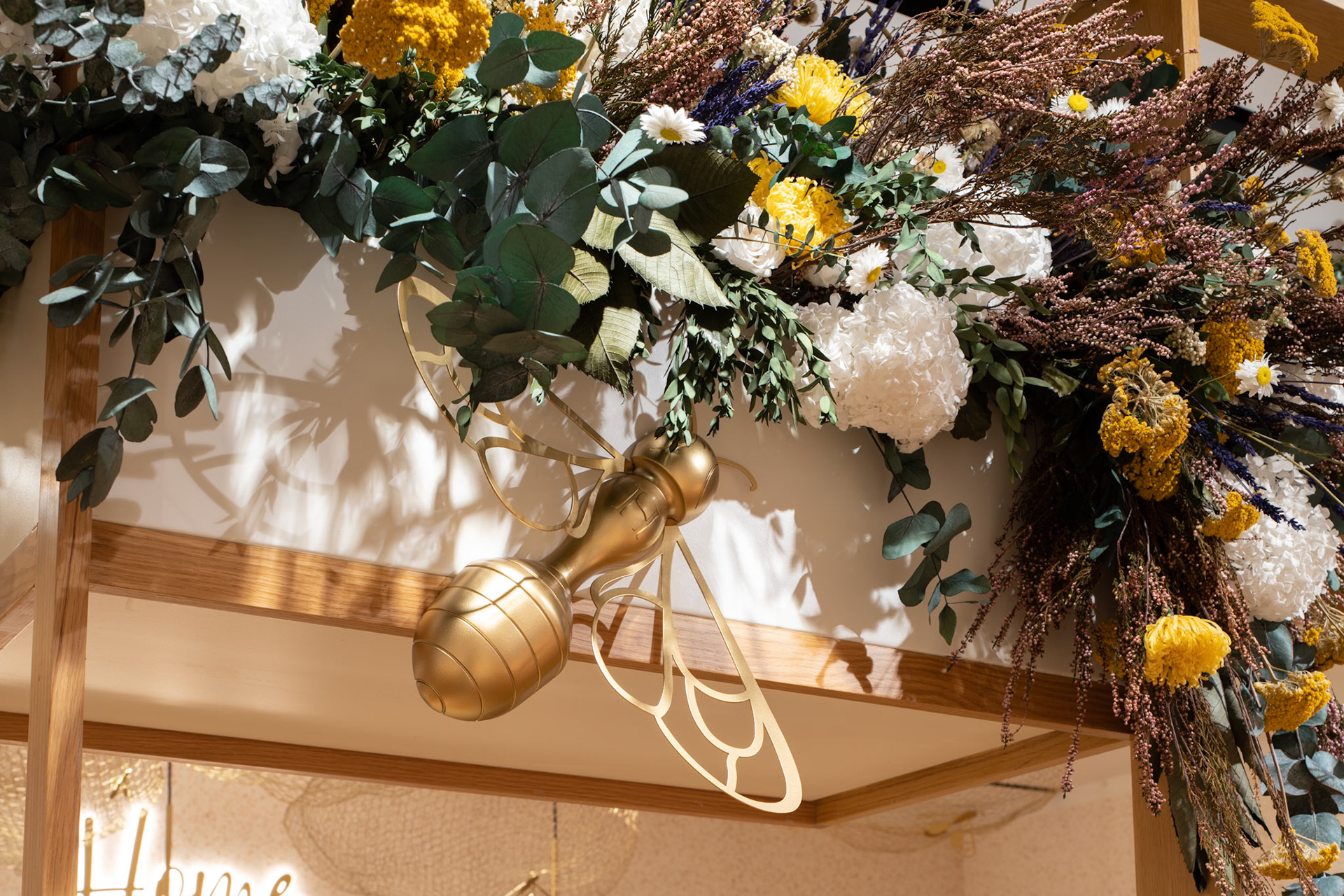 Retail Photography at Hive Installation at Selfridges in London detail image of flowers and gold bee