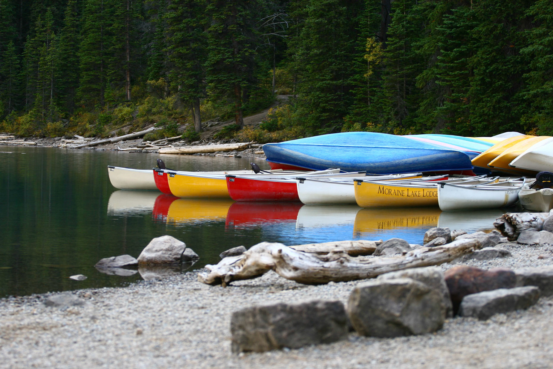 Boats at Lake Moraine at Banff national park with reflection on the water