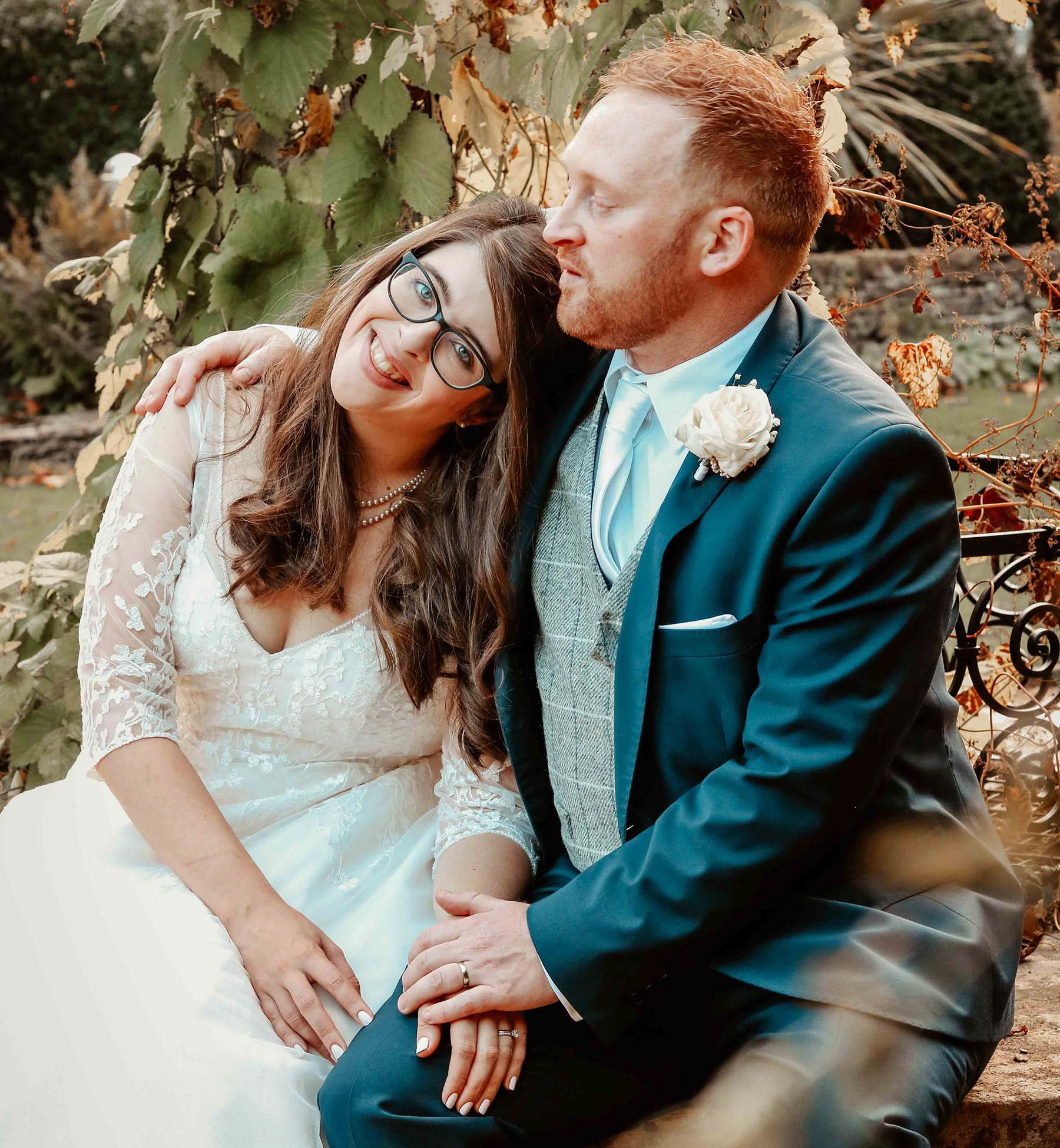 bride groom sat smiling on well at bay tree hotel wedding venue