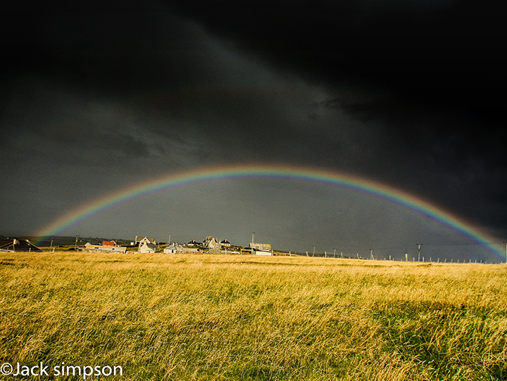 Atmospheric shot of a double Rainbow over the township of Ness on the Isle of Lewis, Western Isles, Scotland
