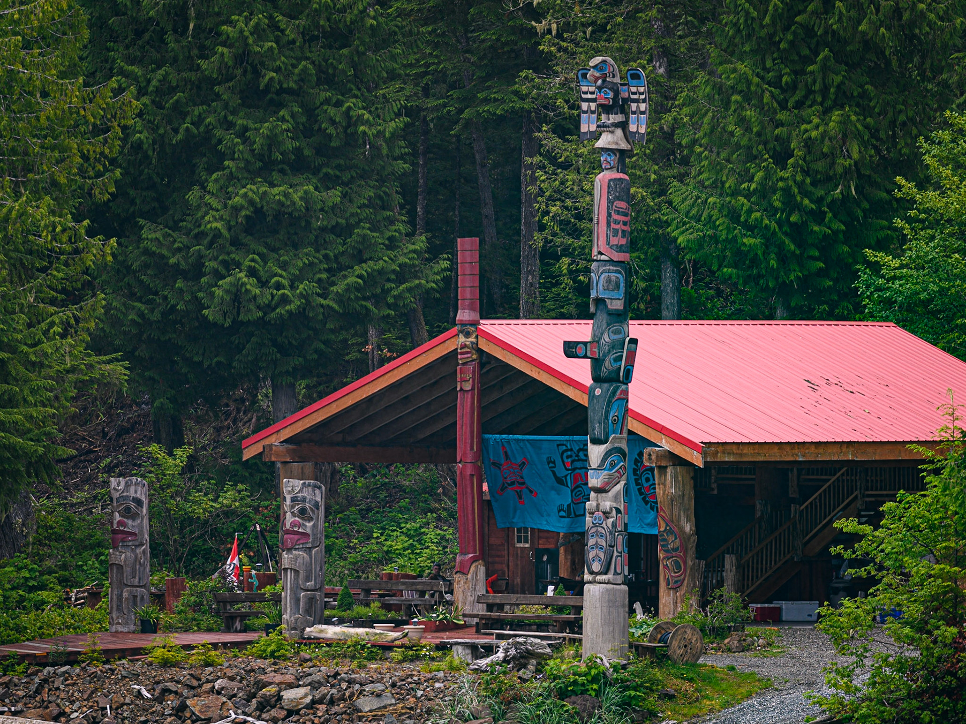 Home with totem poles, near Bella Bella, B.C.