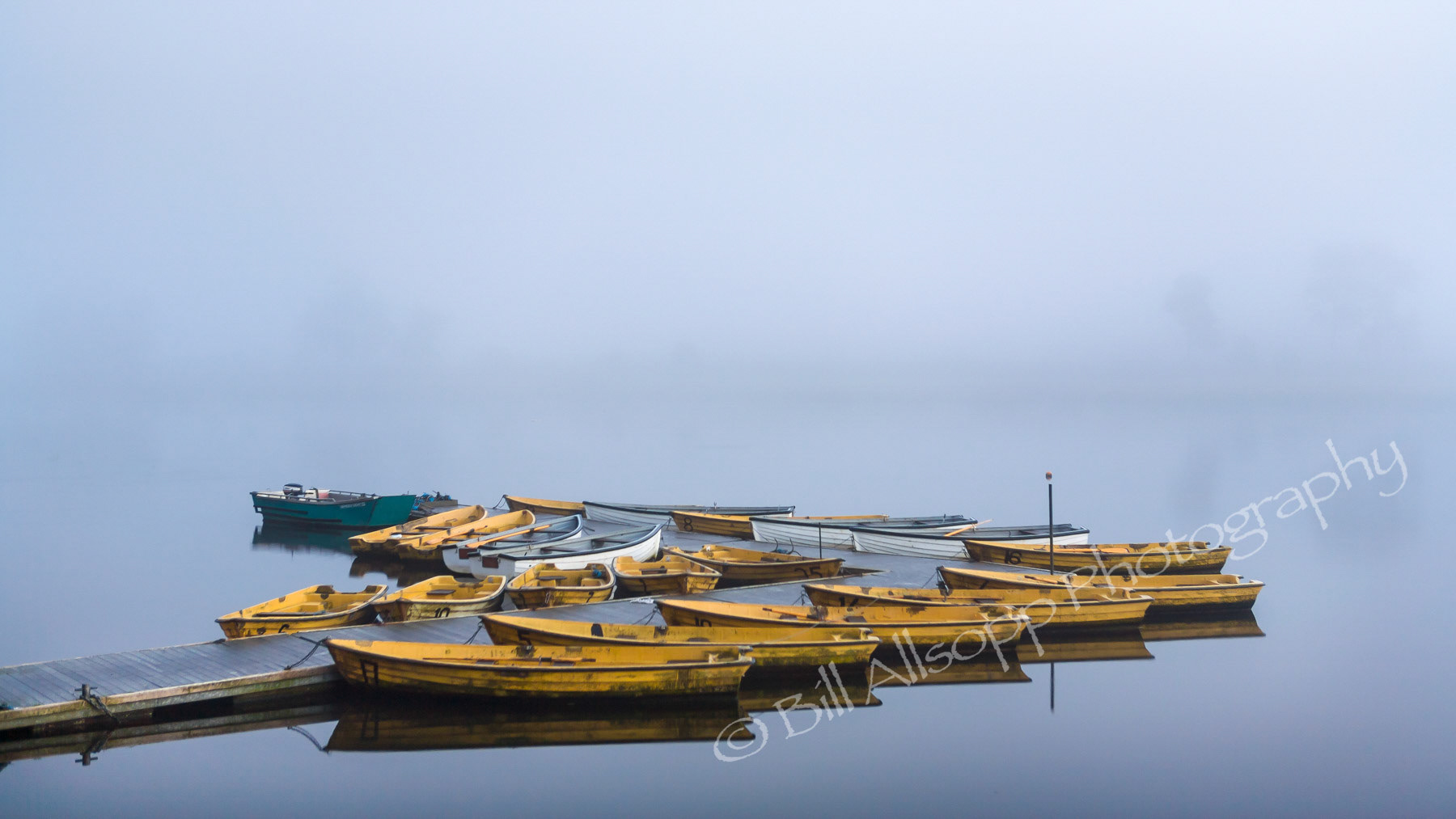Anglers boats at Thornton reservoir.