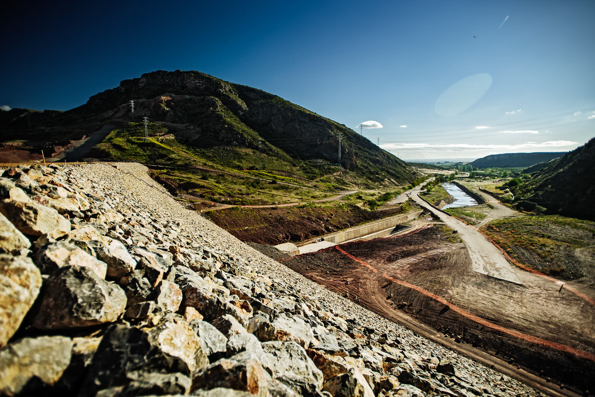 Mularroya Reservoir. La Almunia de Doña Godina, Zaragoza, Aragón. Despite that environmental organizations early claimed that the reservoir would affect negatively a large protected area in Mularroya, the construction started anyway in 2008. The environmental impact assessment (EIA) was revoked in 2009, but the construction continued until 2013, when the Spanish Supreme Court stopped the construction, and so it remains since then. In order to bypass the need of an EIA, the Spanish government declared the reservoir object of prime public interest, which might enable the construction to be resumed if compensatory measures are taken. However, the legal battle is not over as the environmentalists claim that this procedure can only be invoked under extraordinary circumstances, which is not the case here. Cost: €128 million plus overrun.